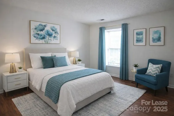 an empty room with wooden floor and window