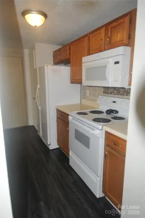 a kitchen with a sink and a refrigerator