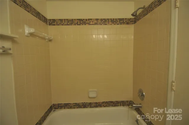 an empty room with wooden floor and window