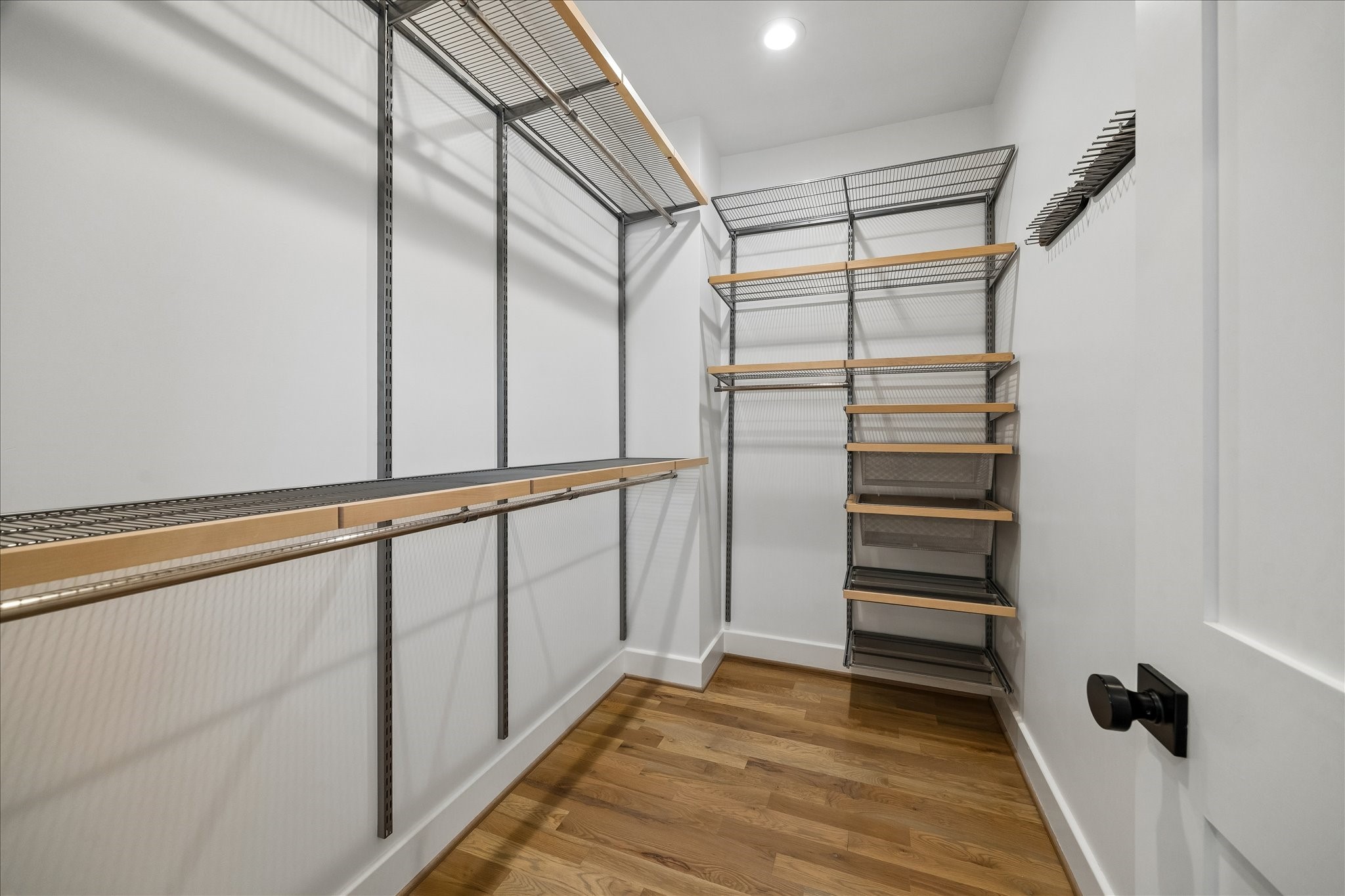 1205 Temple Street Houston, TX 77009 - Photo 23 of 33 A beautifully designed custom closet offers exceptional organization while elevating the everyday routine with thoughtful built-ins and generous storage.
