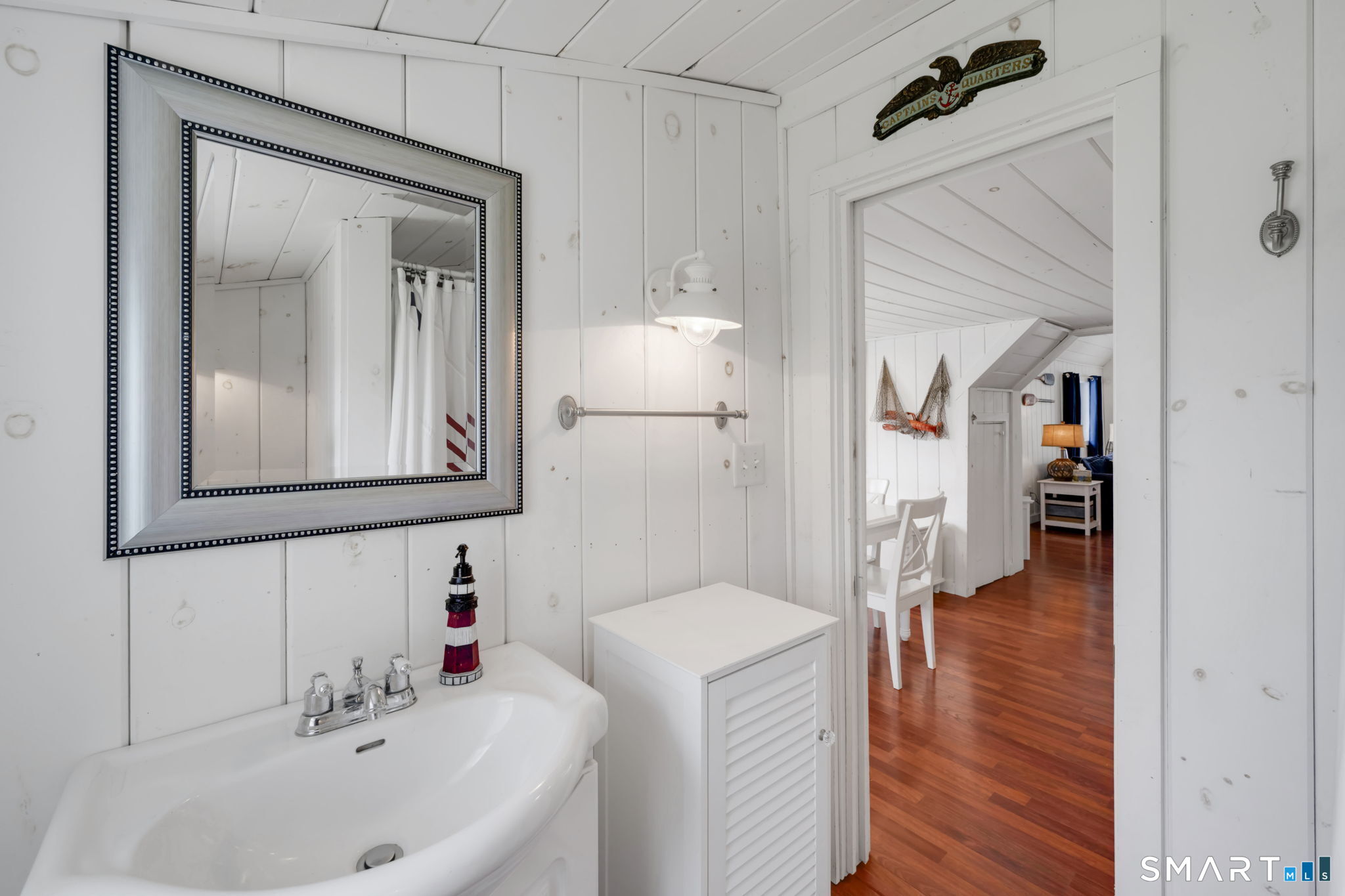 96 Chalker Beach Road Old Saybrook, CT 06475 - Photo 21 of 33 a en suite bathroom with a sink and a mirror