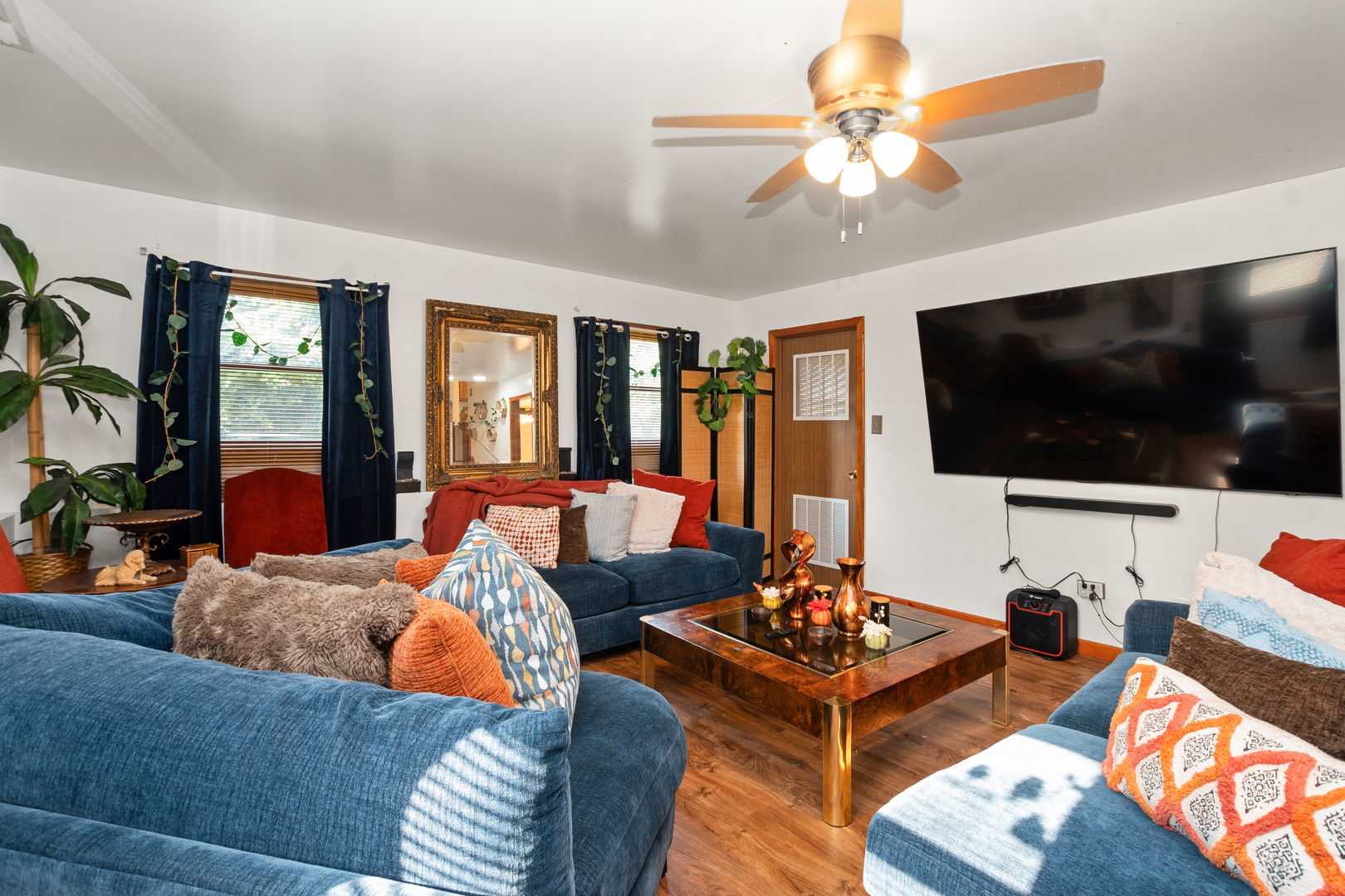 928 East 153rd Street Phoenix, IL 60426 - Photo 14 of 24 a living room with furniture and a flat screen tv