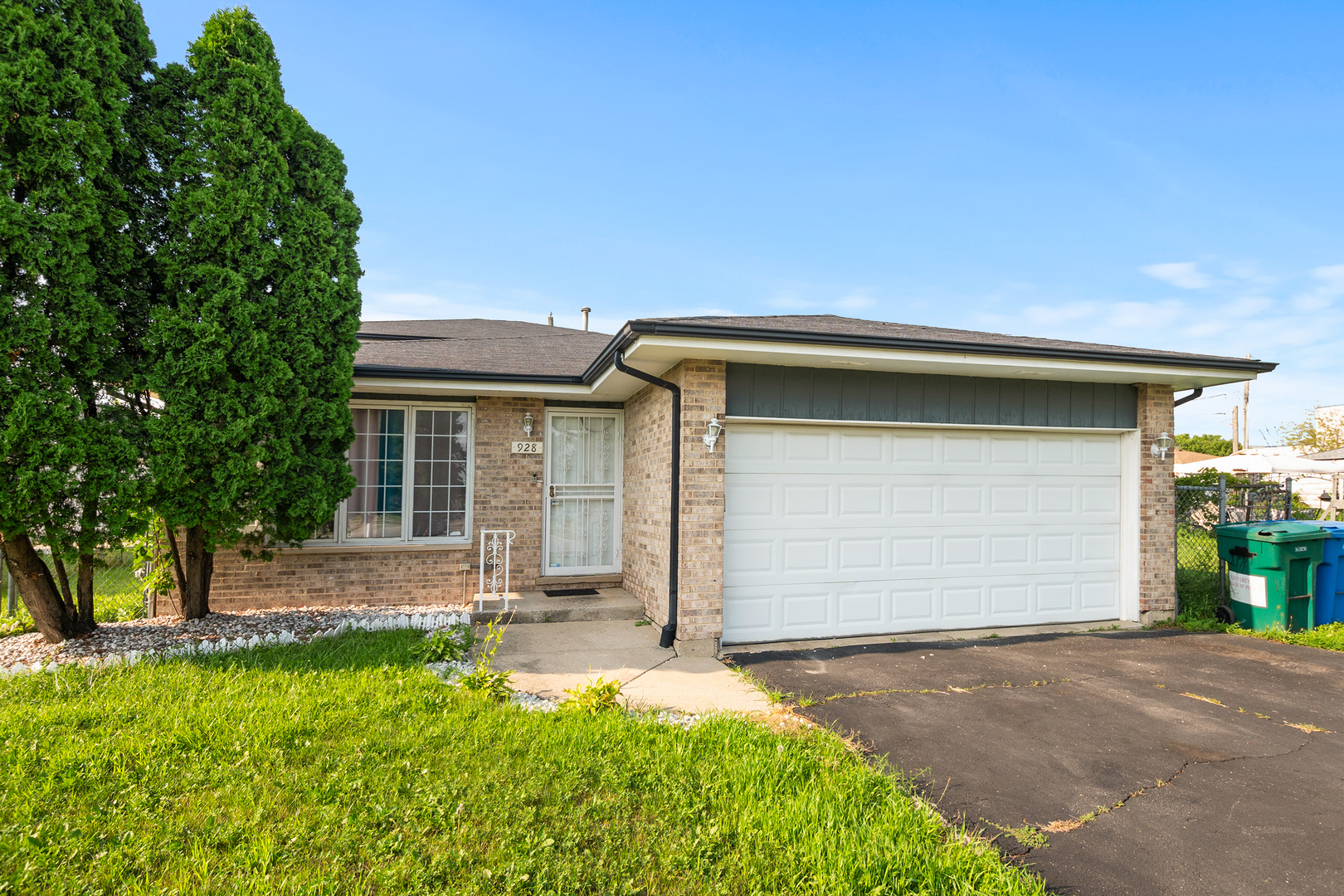 928 East 153rd Street Phoenix, IL 60426 - Photo 3 of 24 a front view of house with yard