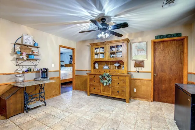 a kitchen with a sink a stove and cabinets