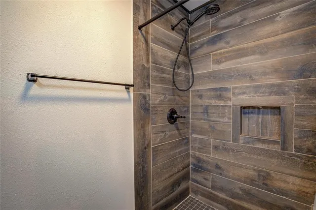 a view of a livingroom with furniture and a bedroom