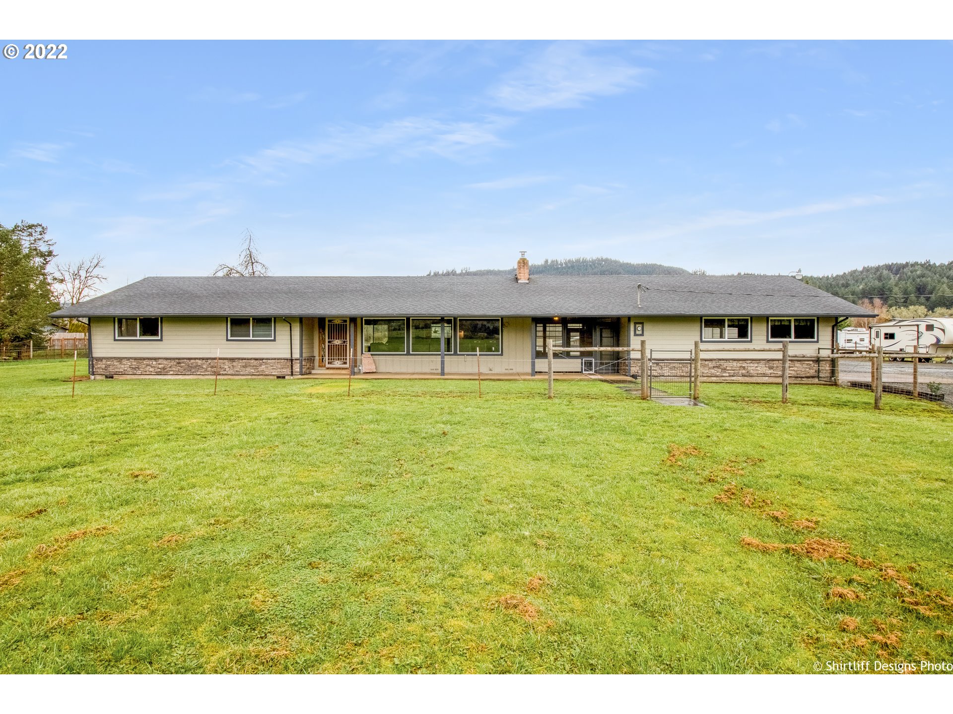 90818 Marcola Road Springfield, OR 97478 - Photo 1 of 32 a view of a swimming pool with an outdoor space and seating area