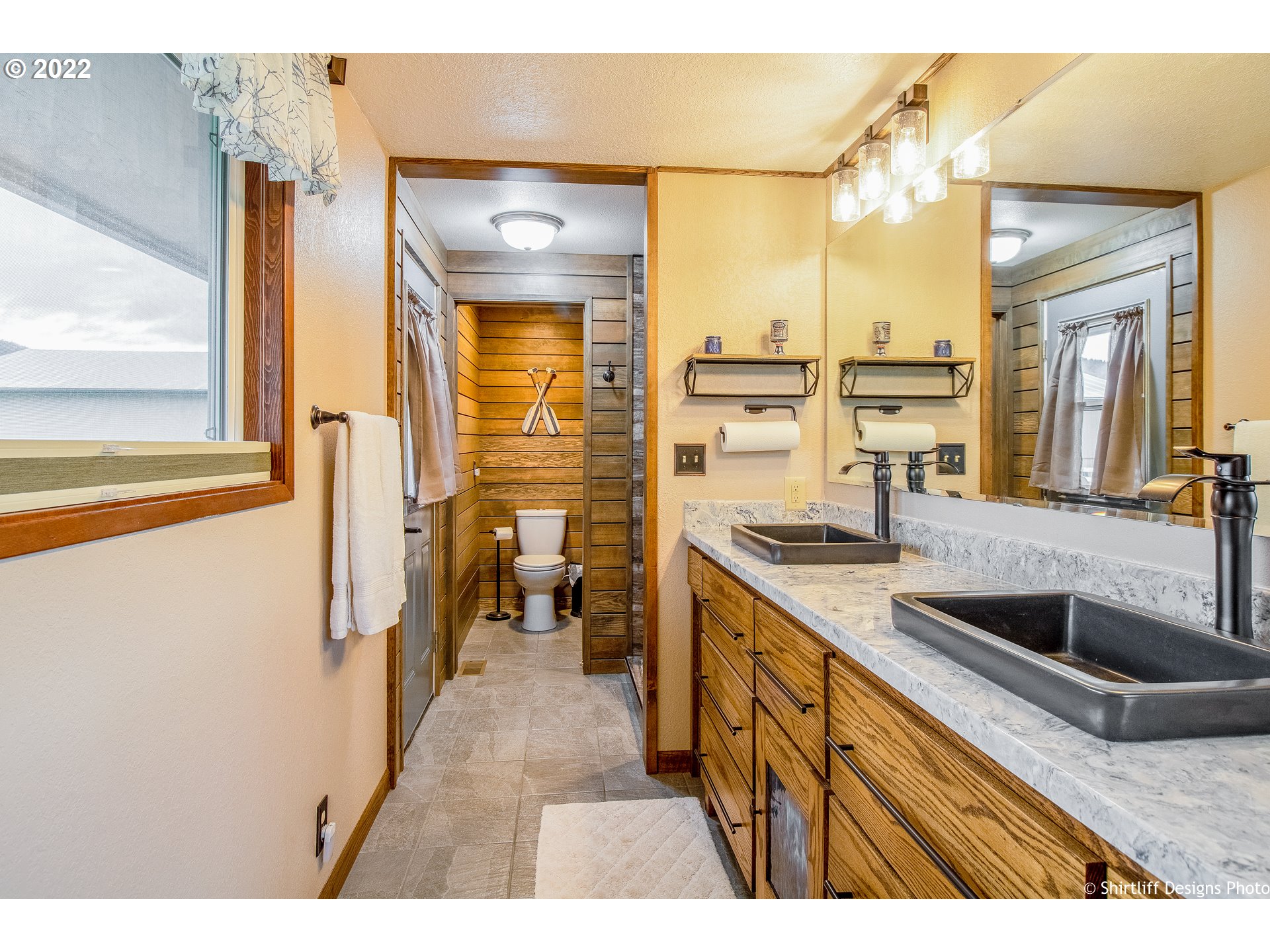 90818 Marcola Road Springfield, OR 97478 - Photo 12 of 32 a kitchen with stainless steel appliances granite countertop a sink and a refrigerator