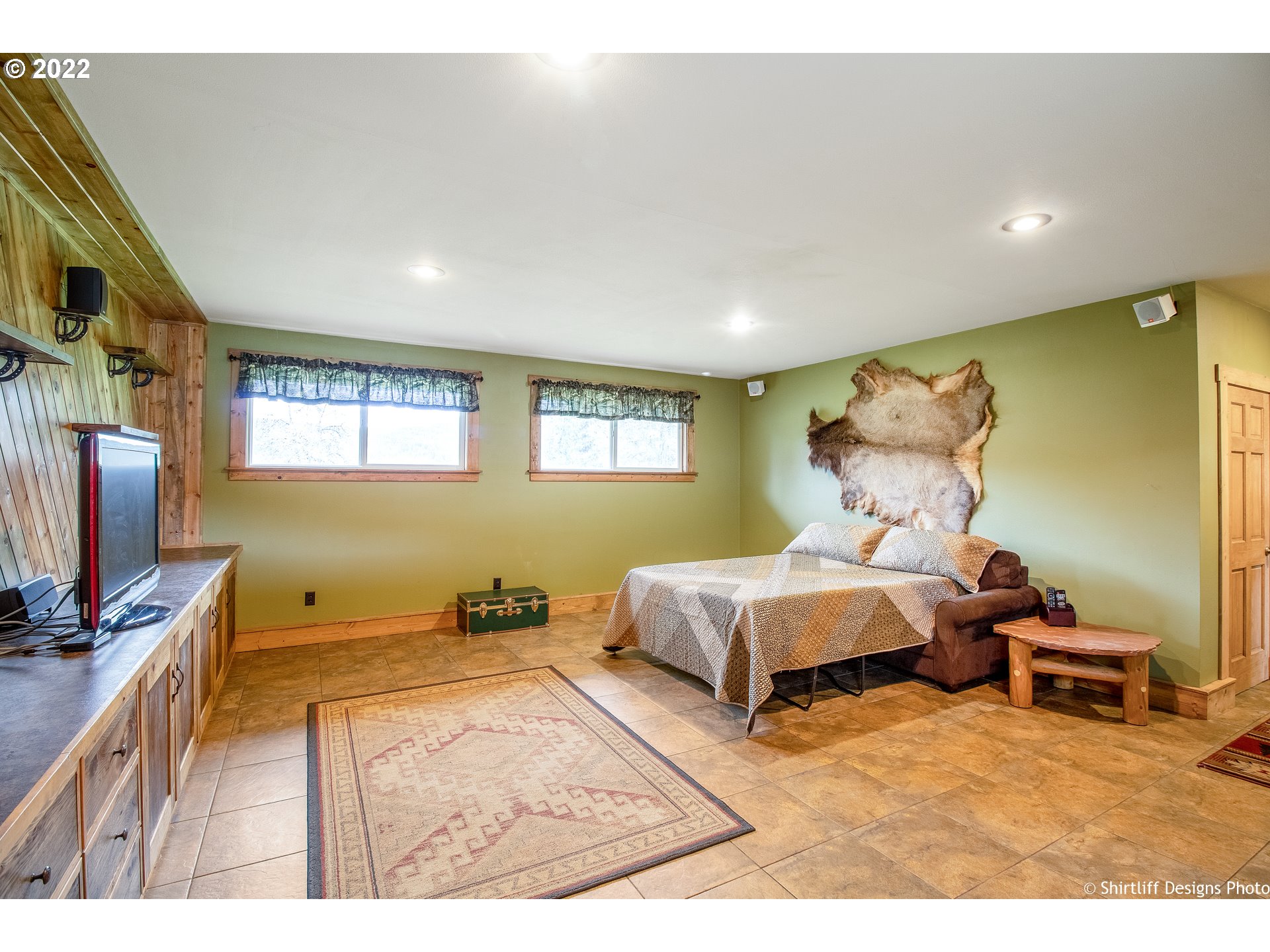 90818 Marcola Road Springfield, OR 97478 - Photo 20 of 32 a bedroom with a bed and wooden floor