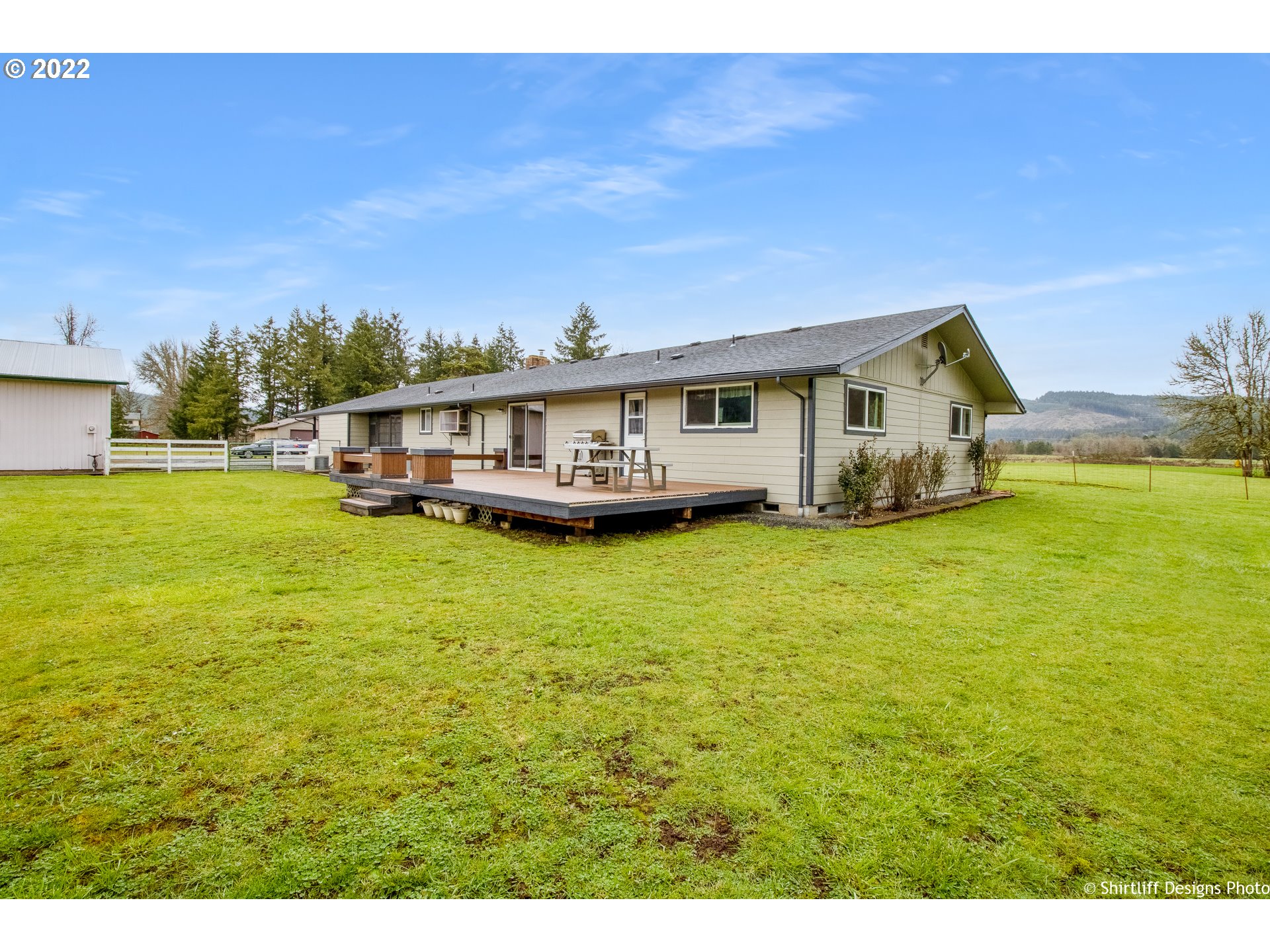 90818 Marcola Road Springfield, OR 97478 - Photo 29 of 32 a view of a house with a big yard and large trees