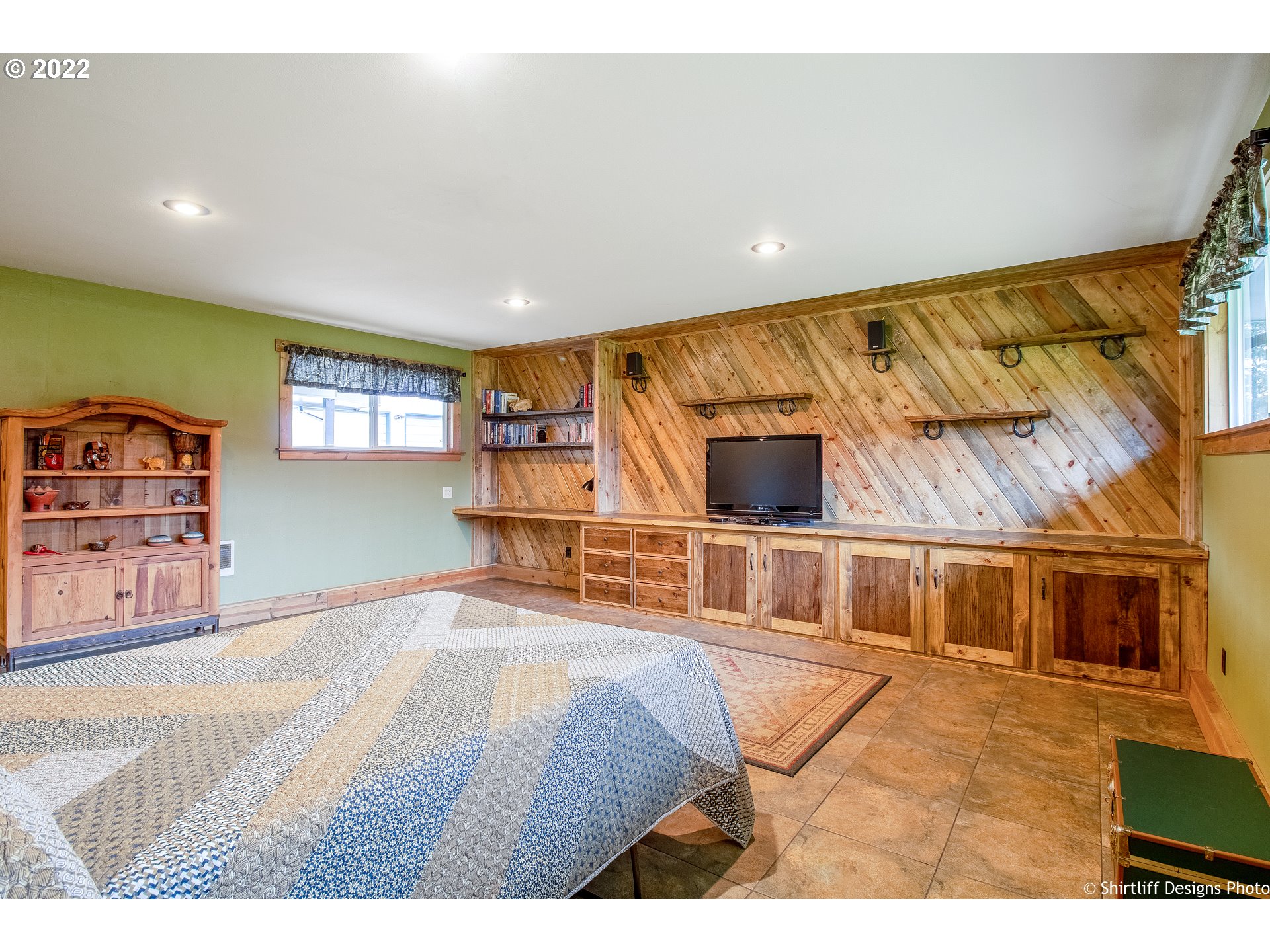 90818 Marcola Road Springfield, OR 97478 - Photo 32 of 32 a bedroom with furniture and a flat screen tv