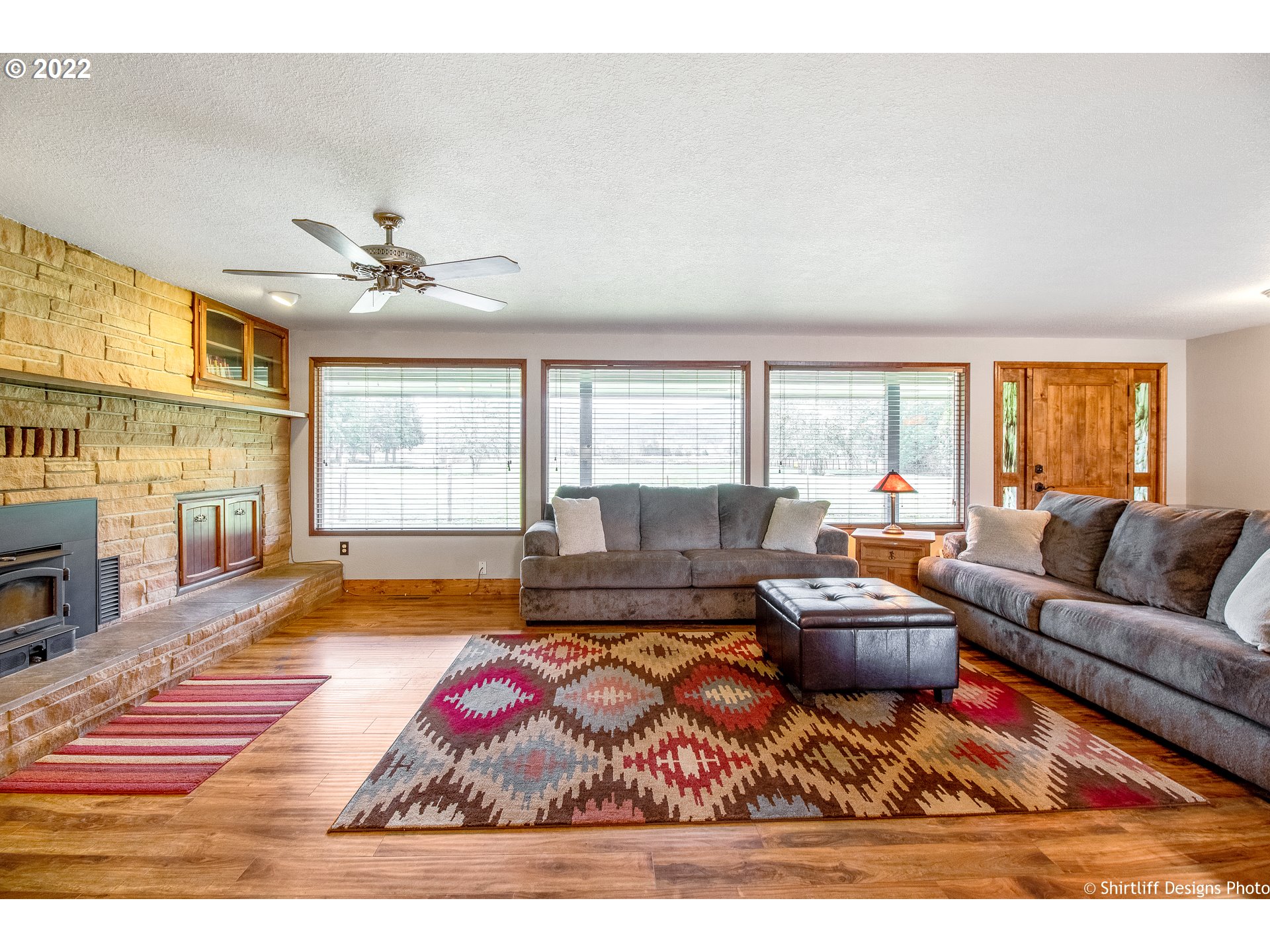 90818 Marcola Road Springfield, OR 97478 - Photo 4 of 32 a living room with furniture fireplace and a large window