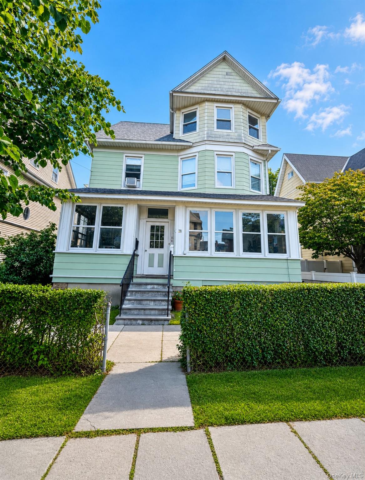 79 Division Street, Unit 3 New Rochelle, NY 10805 - Photo 1 of 17 Three-story residence featuring a light green siding and a prominent bay window structure