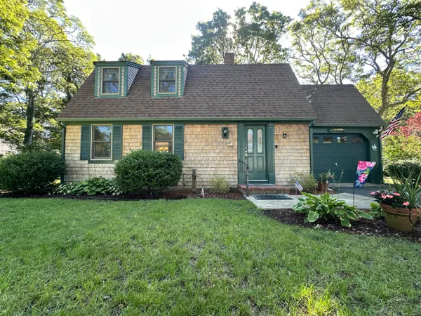 a view of a house with garden and yard