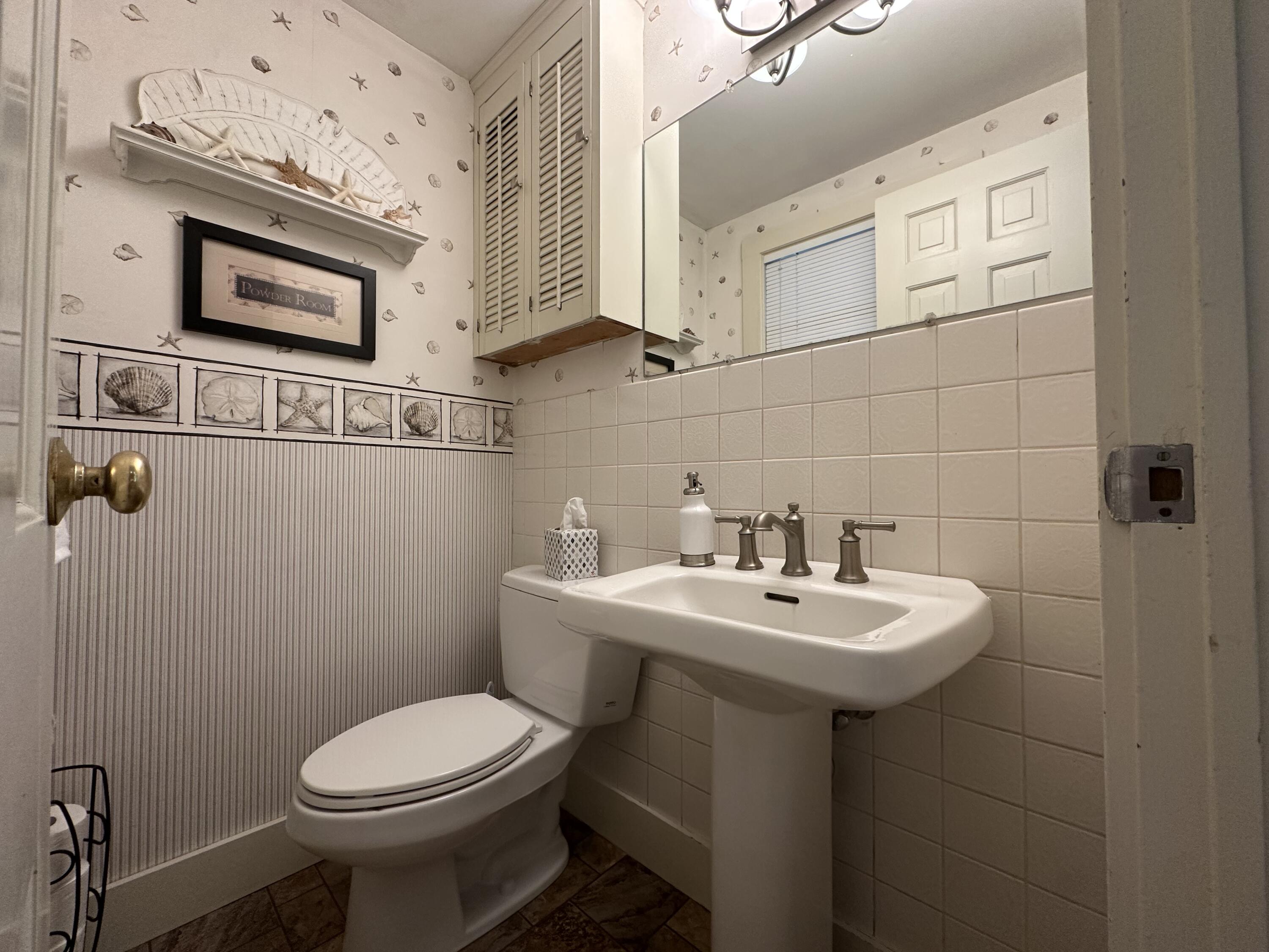 2 Longview Drive Centerville, MA 02632 - Photo 29 of 45 a bathroom with a sink a mirror and toilet