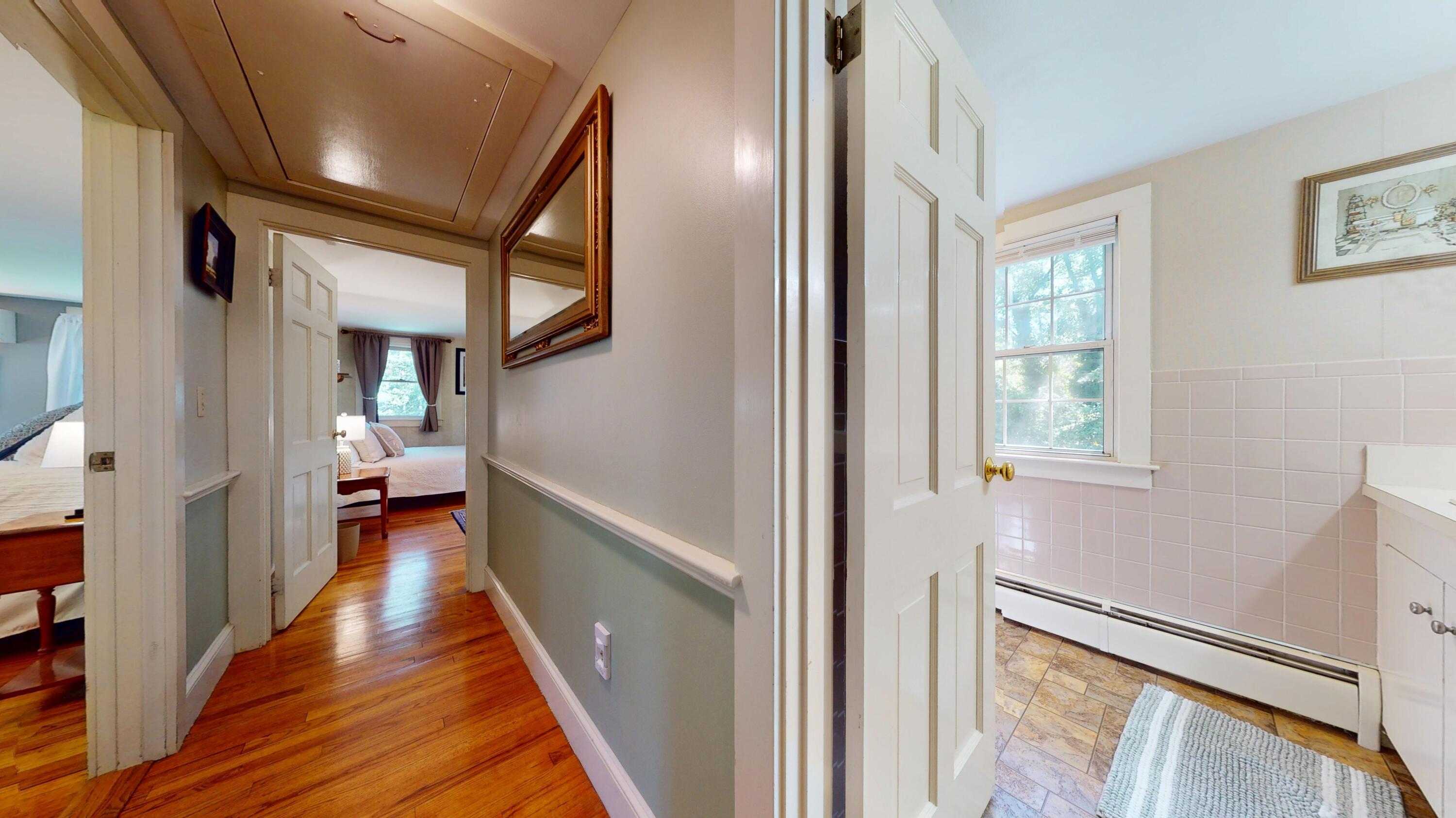 2 Longview Drive Centerville, MA 02632 - Photo 32 of 45 a view of a hallway with wooden floor and staircase