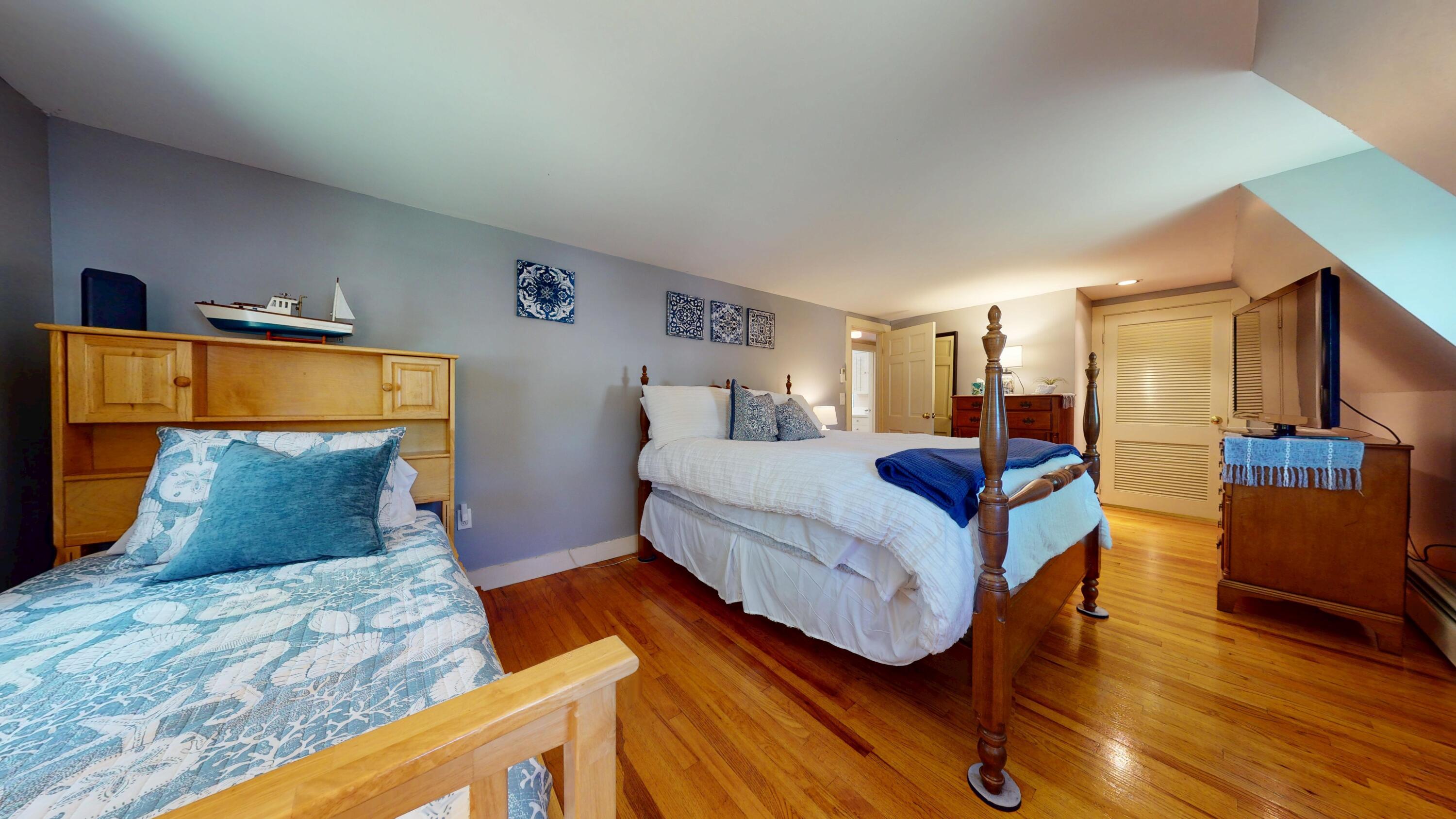 2 Longview Drive Centerville, MA 02632 - Photo 34 of 45 a bedroom with bed and wooden floor