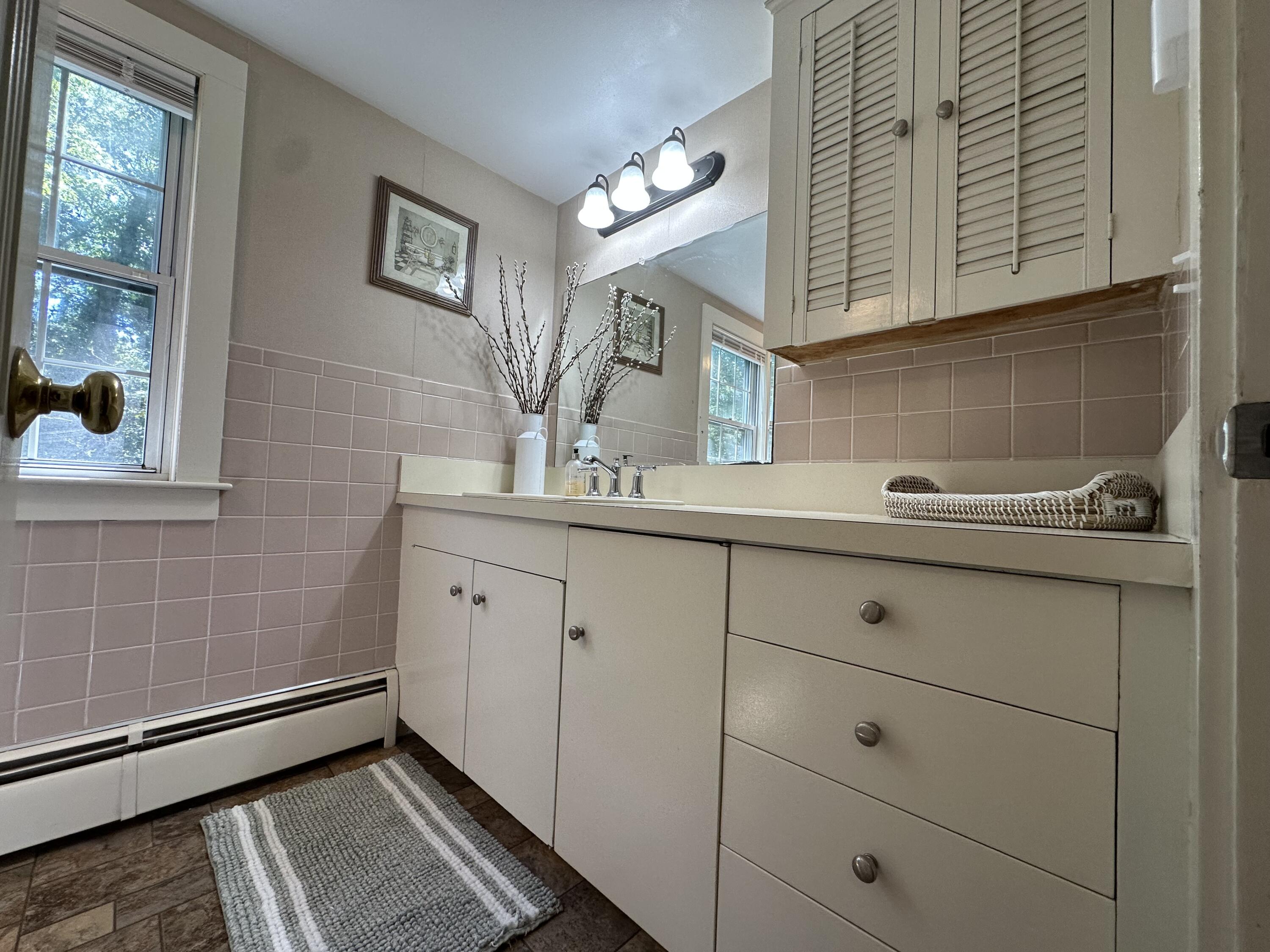 2 Longview Drive Centerville, MA 02632 - Photo 36 of 45 a bathroom with a sink and a mirror