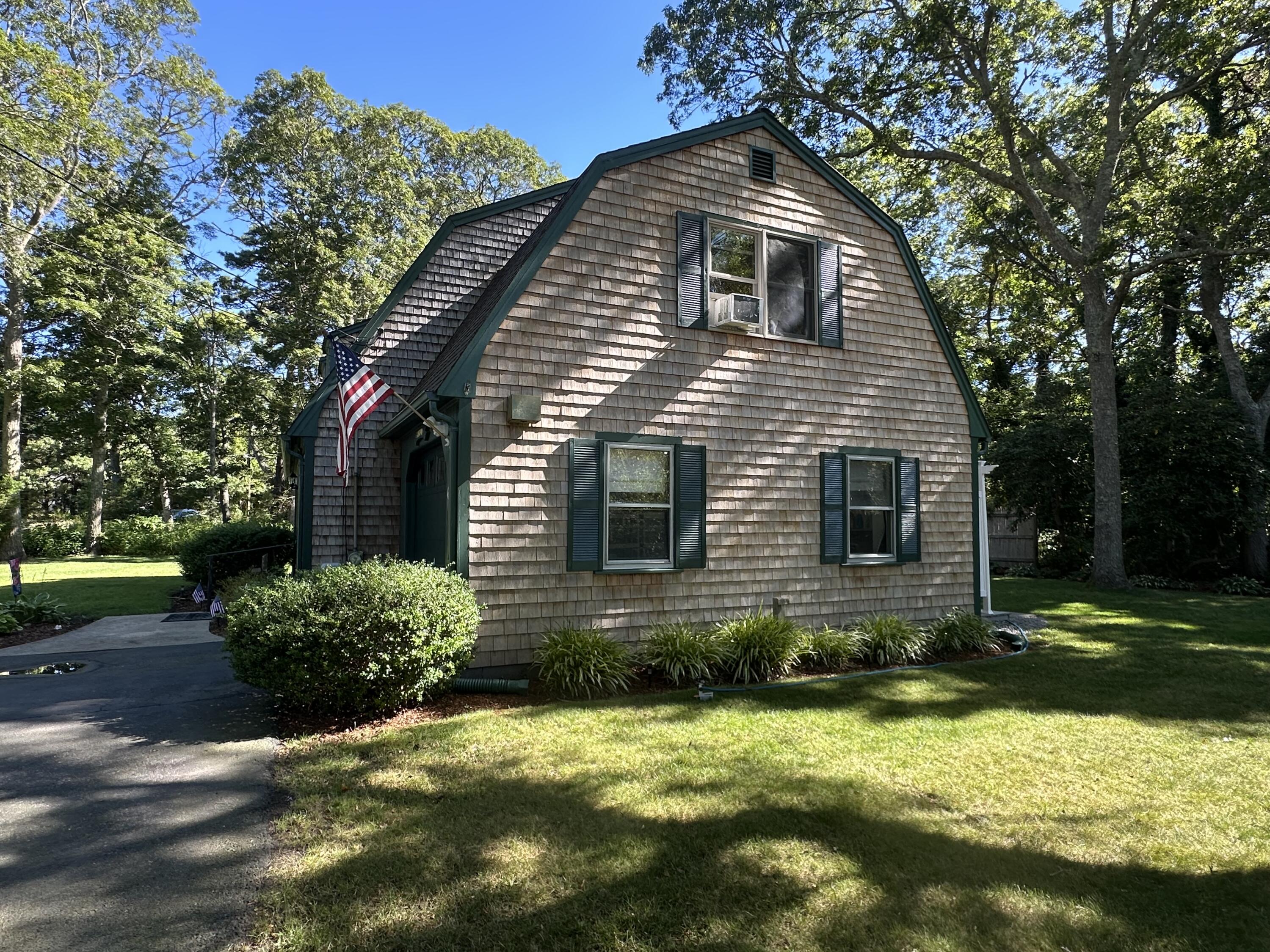 2 Longview Drive Centerville, MA 02632 - Photo 9 of 45 a front view of a house with a yard