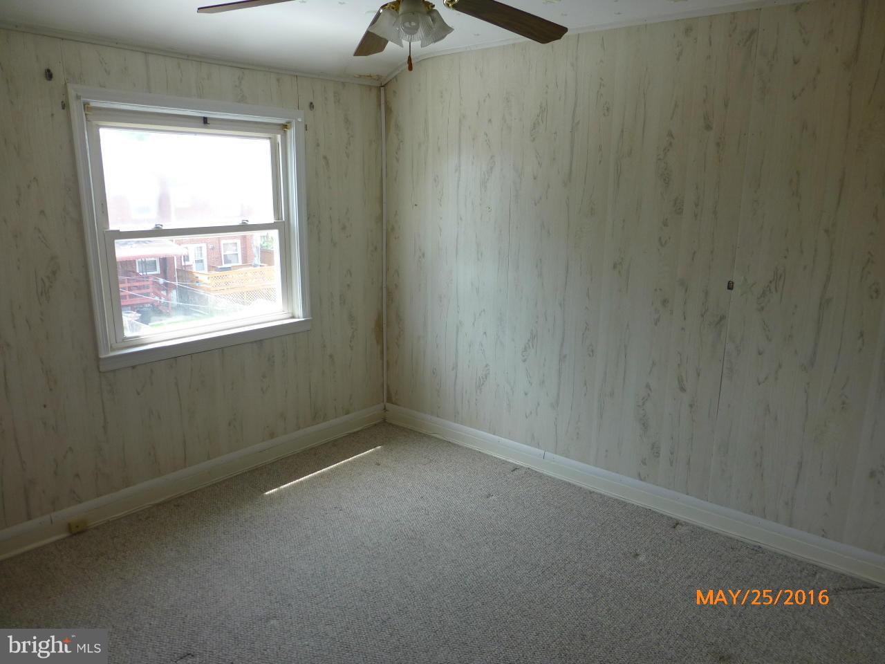 949 Middlesex Road Baltimore, MD 21221 - Photo 14 of 17 an empty room with a window
