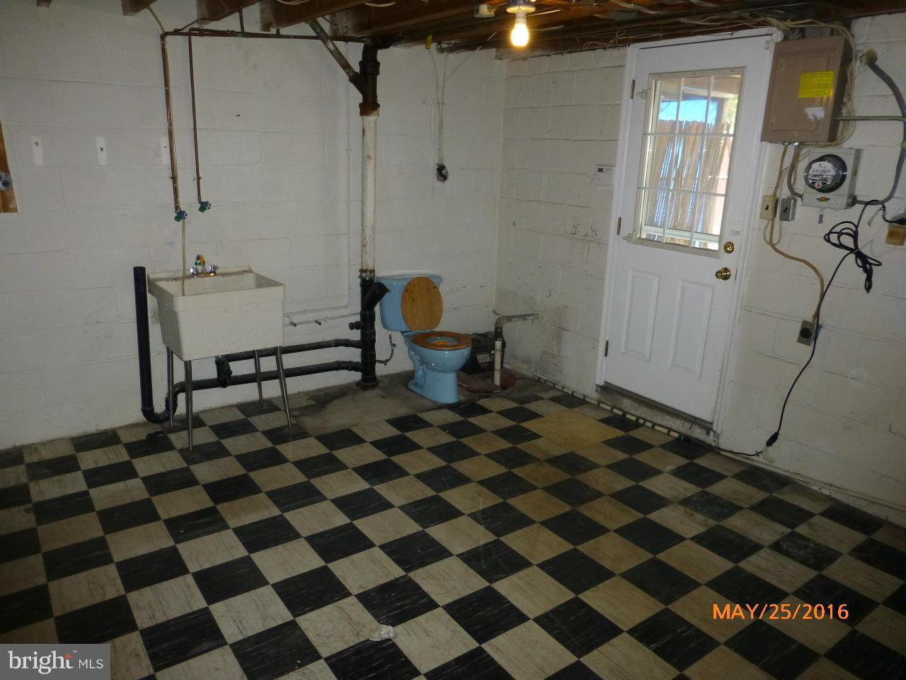 949 Middlesex Road Baltimore, MD 21221 - Photo 16 of 17 a black and white checkered floor with a black white checkered floor