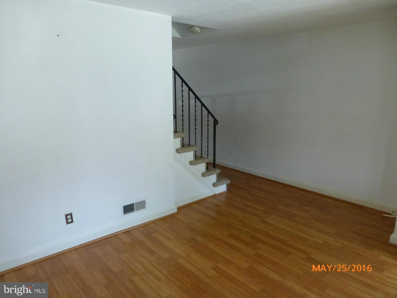 949 Middlesex Road Baltimore, MD 21221 - Photo 9 of 17 a view of a room with wooden floor