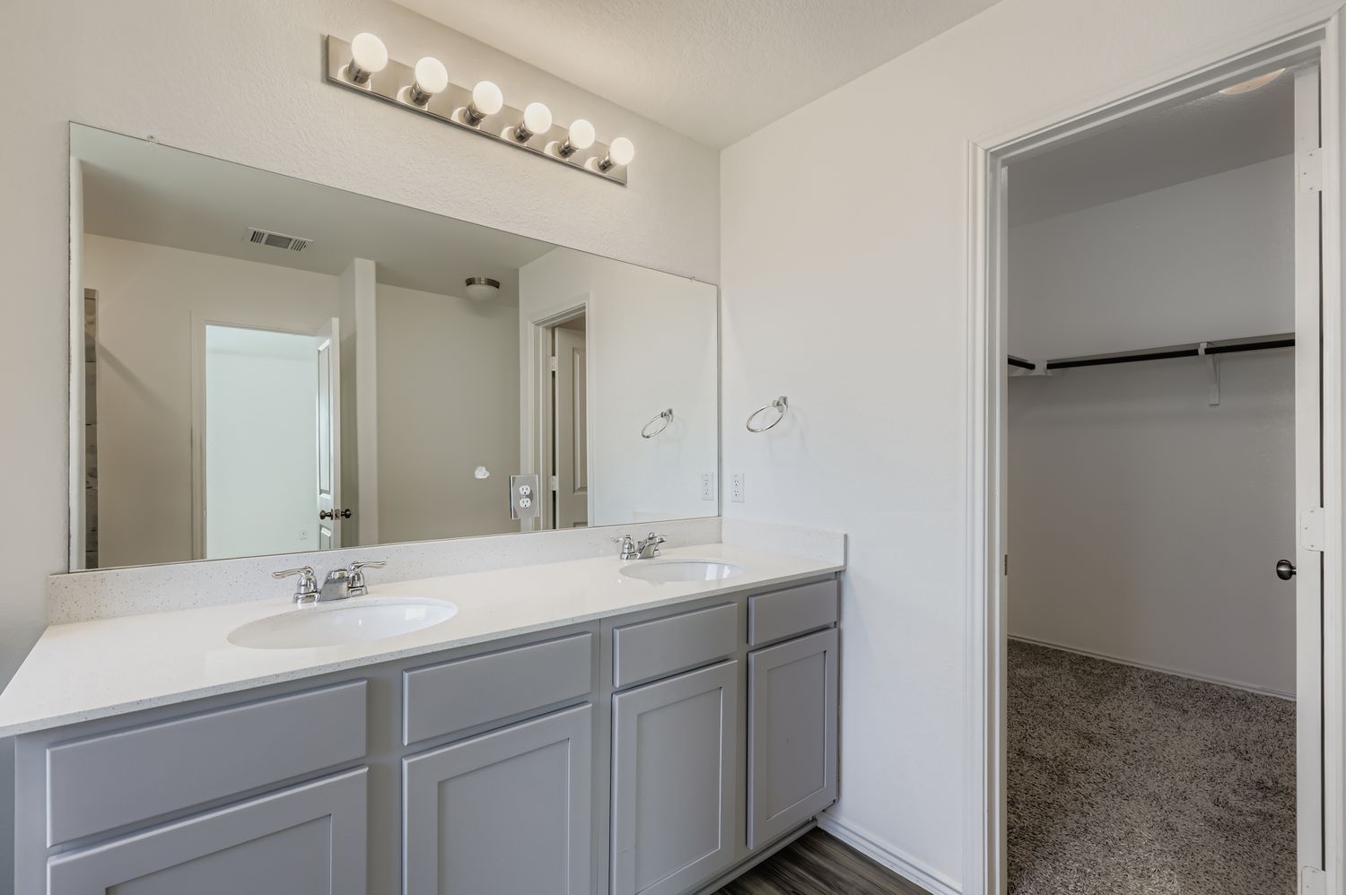 128 Concho Brook Bend Georgetown, TX 78626 - Photo 13 of 28 a bathroom with a double vanity sink and mirror