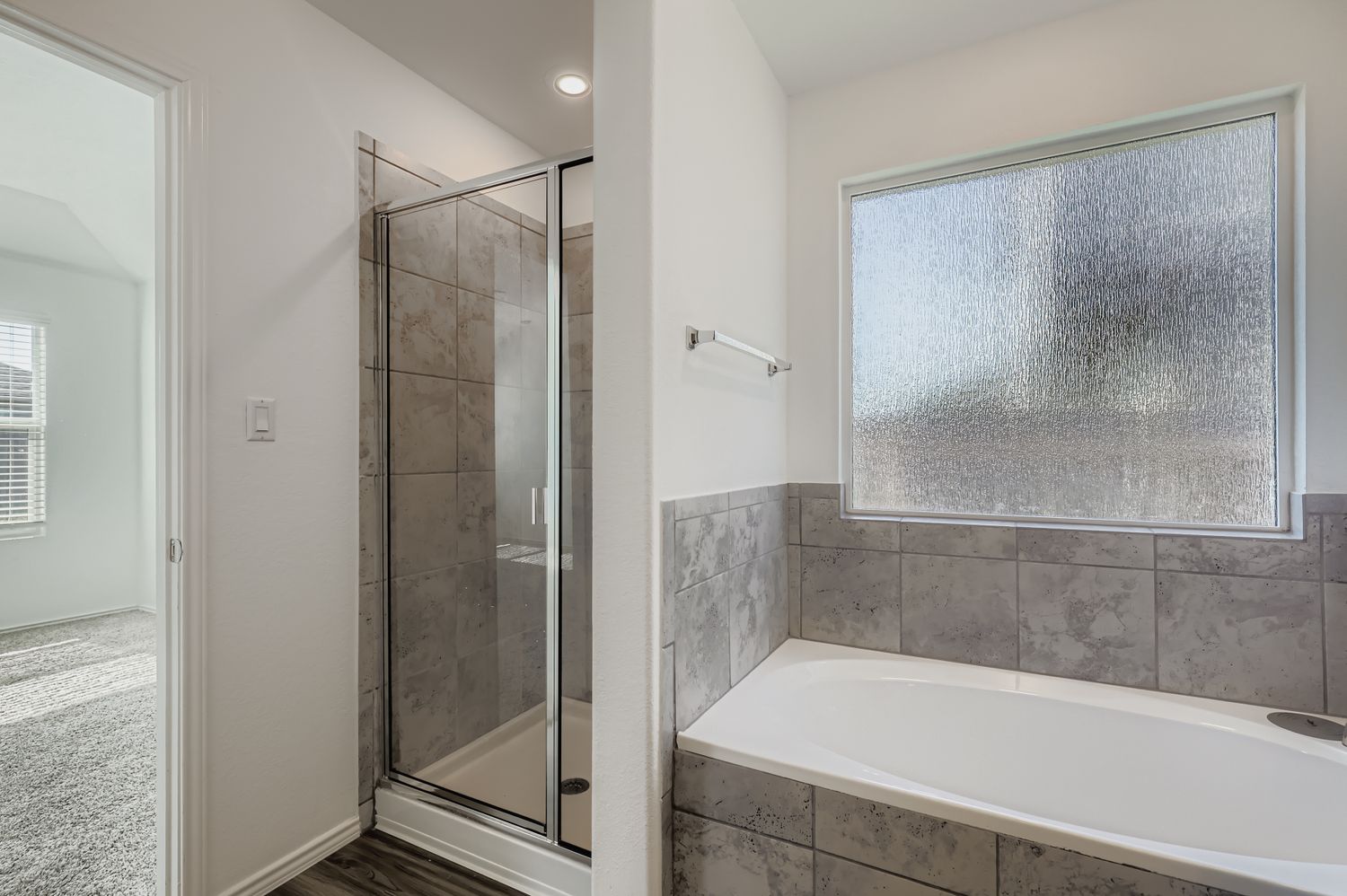 128 Concho Brook Bend Georgetown, TX 78626 - Photo 14 of 28 a bathroom with a bathtub and a shower