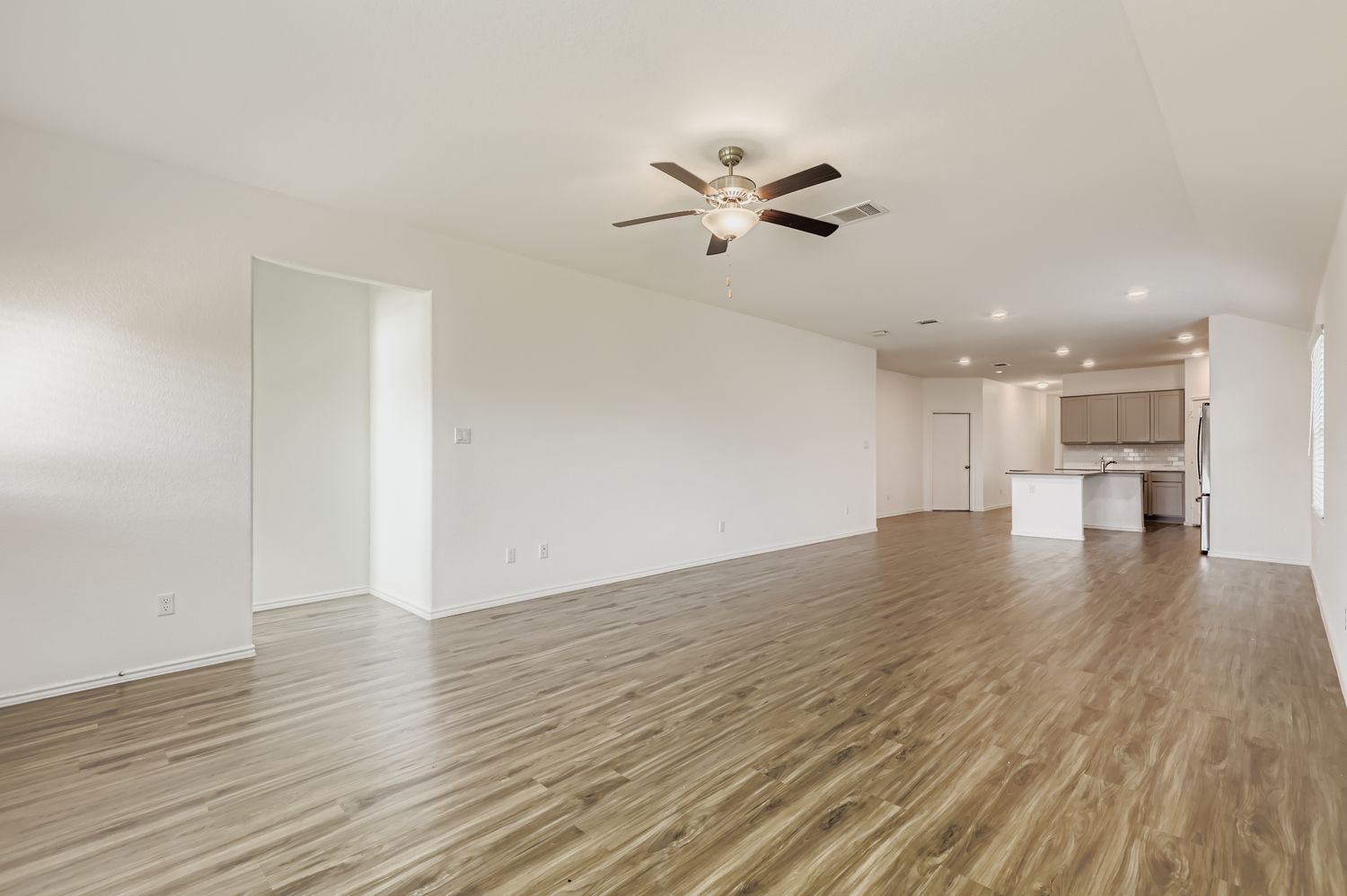 128 Concho Brook Bend Georgetown, TX 78626 - Photo 6 of 28 a view of empty room with wooden floor and window