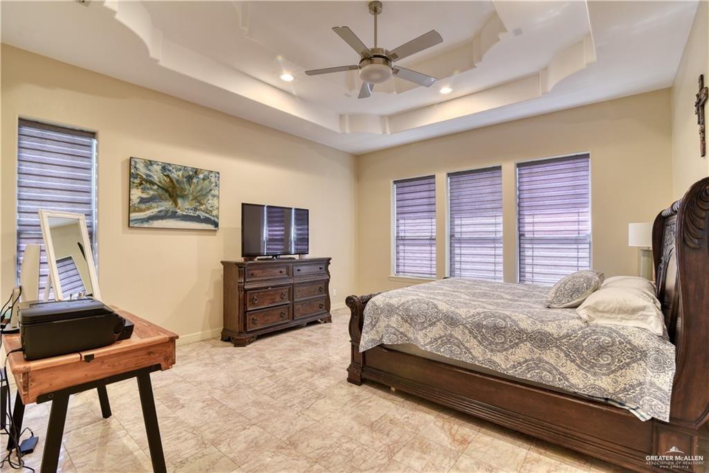 2016 South 48th Street McAllen, TX 78503 - Photo 8 of 9 a bedroom with a bed and a couch