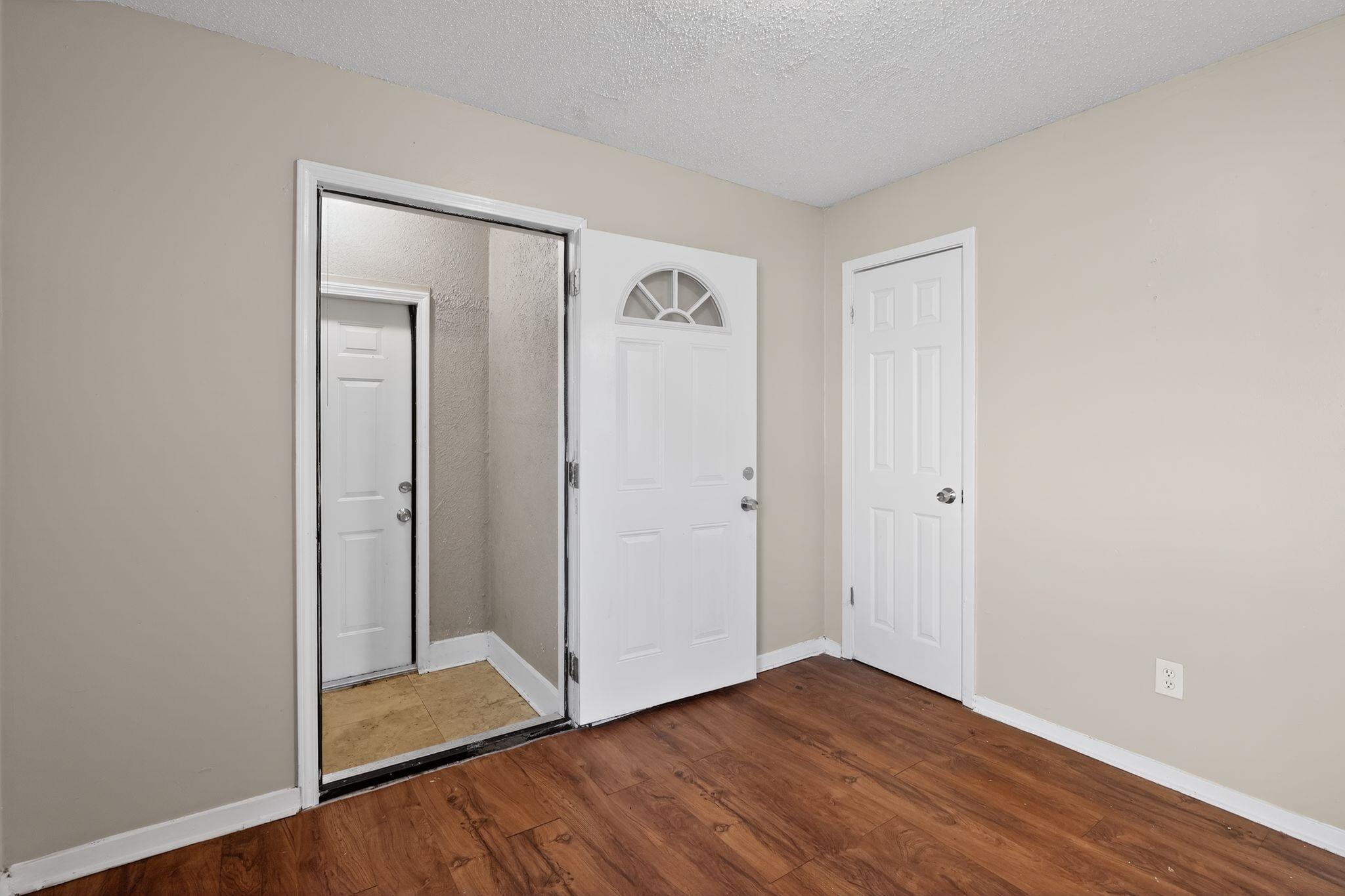 2449 Labonte Drive Memphis, TN 38127 - Photo 19 of 30 a view of an empty room with wooden floor and closet