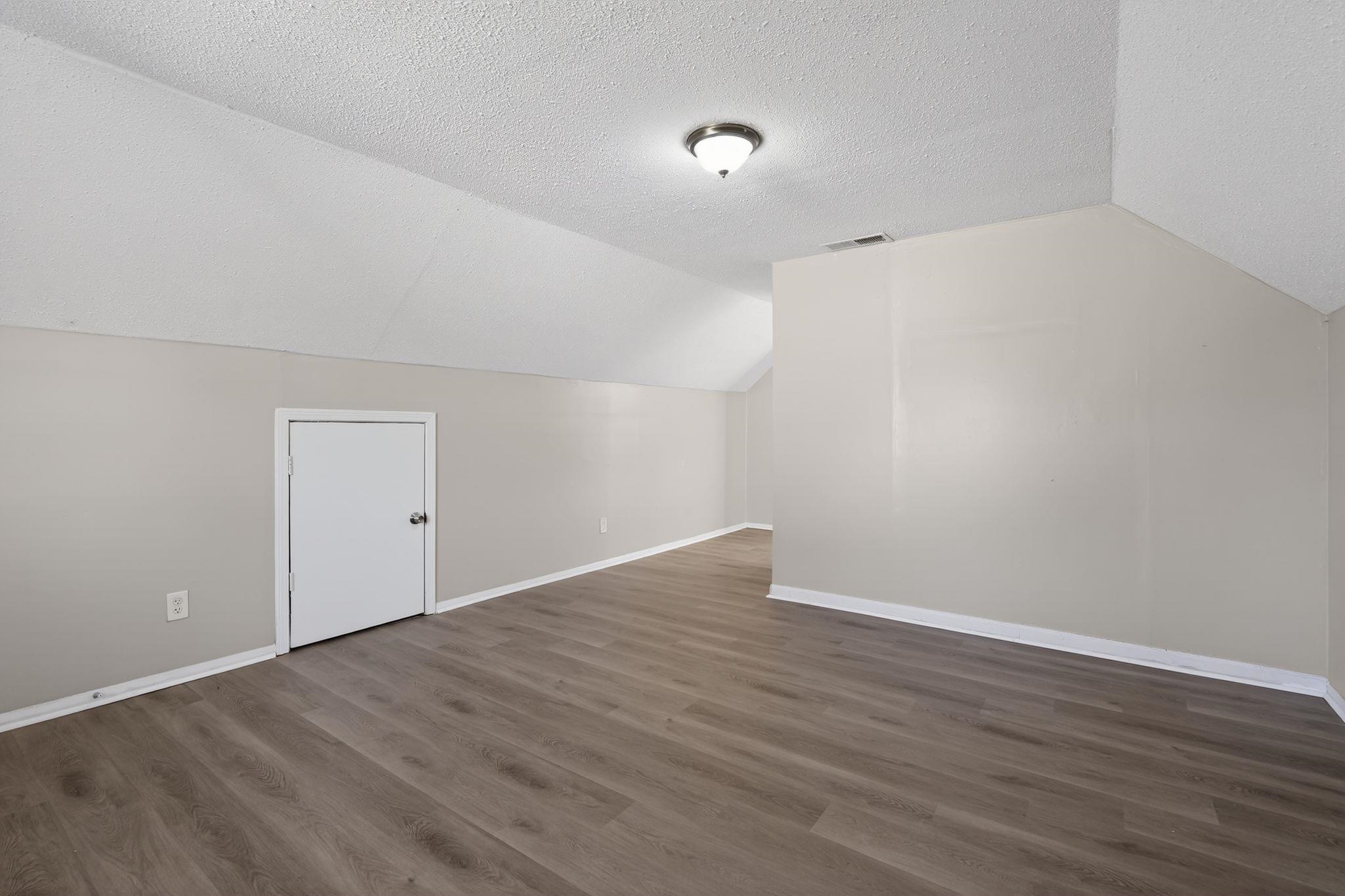 2449 Labonte Drive Memphis, TN 38127 - Photo 26 of 30 a view of an empty room with wooden floor