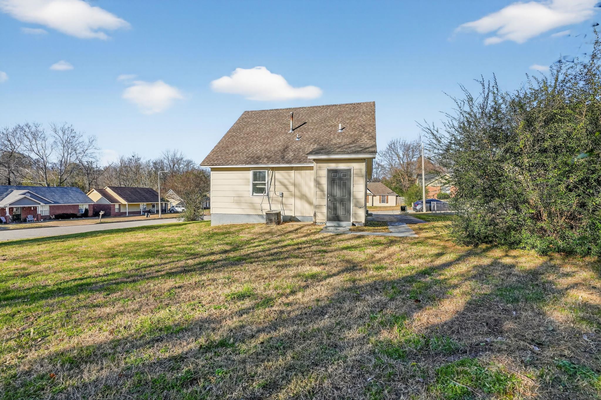 2449 Labonte Drive Memphis, TN 38127 - Photo 30 of 30 a view of a house with a yard and sitting area