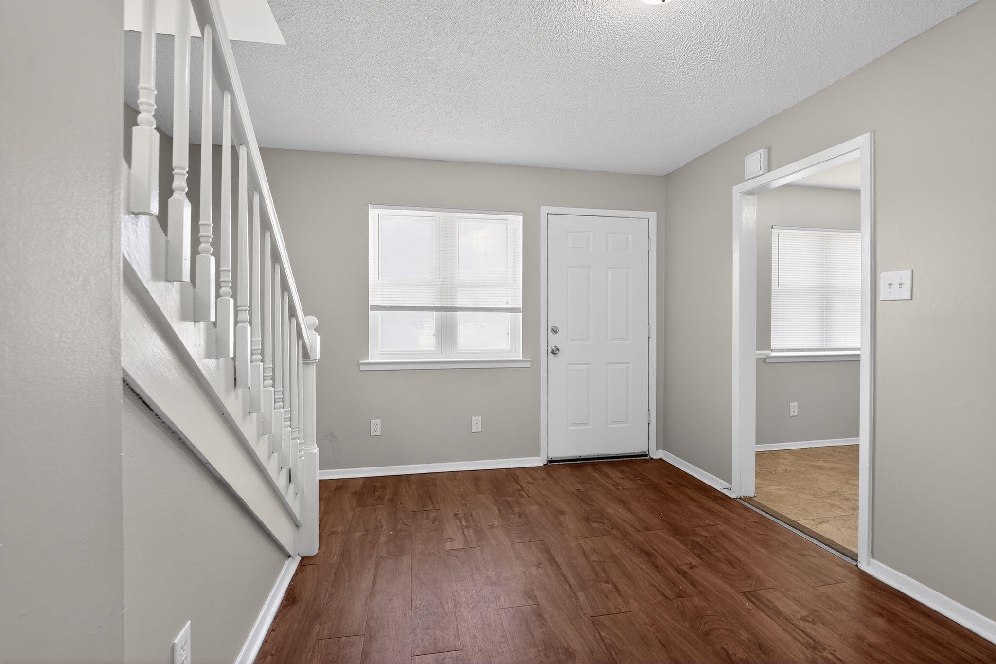 2449 Labonte Drive Memphis, TN 38127 - Photo 6 of 30 wooden floor in an empty room with a window