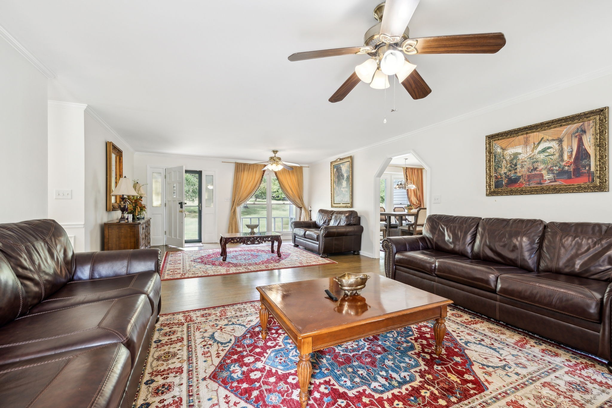 600 Blooming Grove Road Pulaski, TN 38478 - Photo 16 of 68 a living room with furniture a rug and a chandelier
