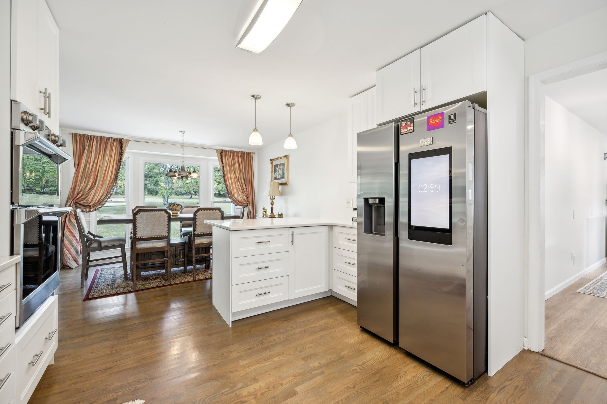 600 Blooming Grove Road Pulaski, TN 38478 - Photo 24 of 68 a kitchen with stainless steel appliances kitchen island granite countertop a refrigerator and microwave