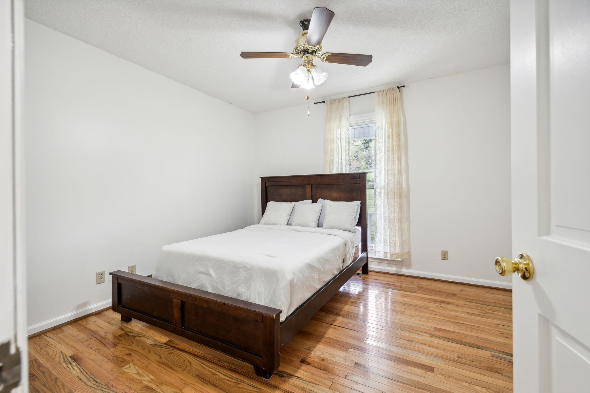 600 Blooming Grove Road Pulaski, TN 38478 - Photo 33 of 68 a bed room with a bed and a ceiling fan