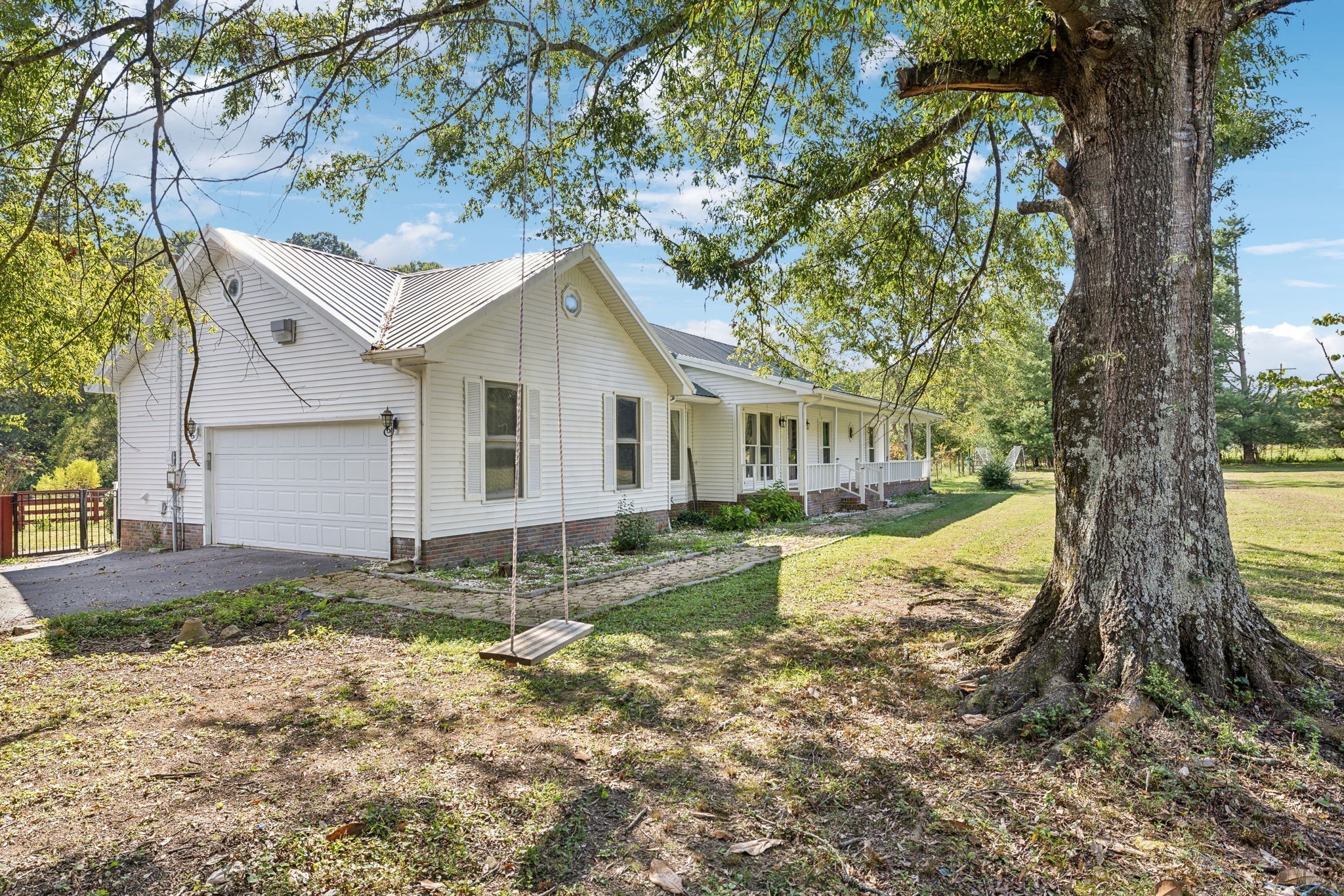 600 Blooming Grove Road Pulaski, TN 38478 - Photo 5 of 68 a view of a house with a yard and large tree