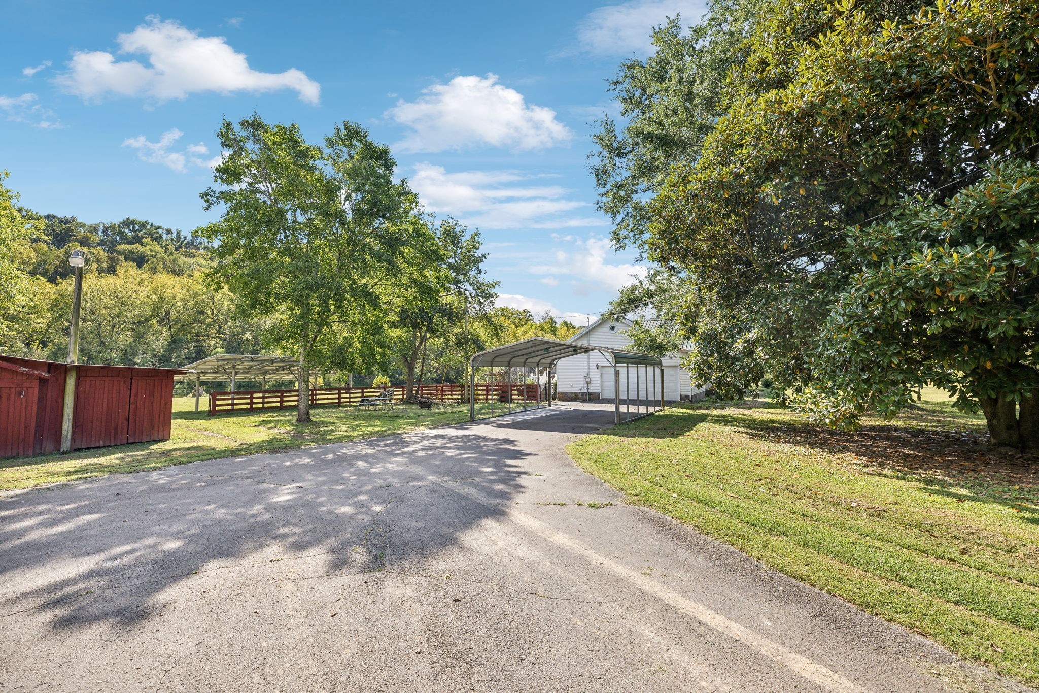 600 Blooming Grove Road Pulaski, TN 38478 - Photo 55 of 68 a view of yard with swimming pool and trees in the background