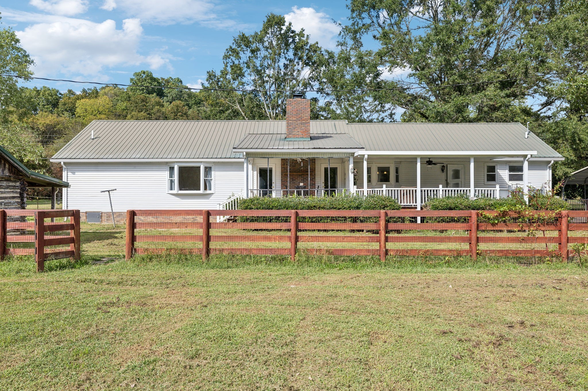 600 Blooming Grove Road Pulaski, TN 38478 - Photo 63 of 68 a white house that has a tree in front of it