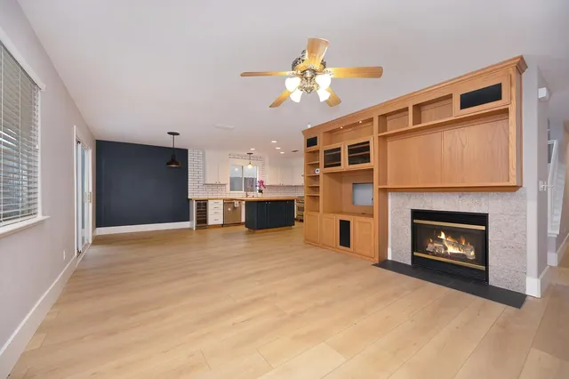 a kitchen with stainless steel appliances granite countertop hardwood a sink stove and refrigerator