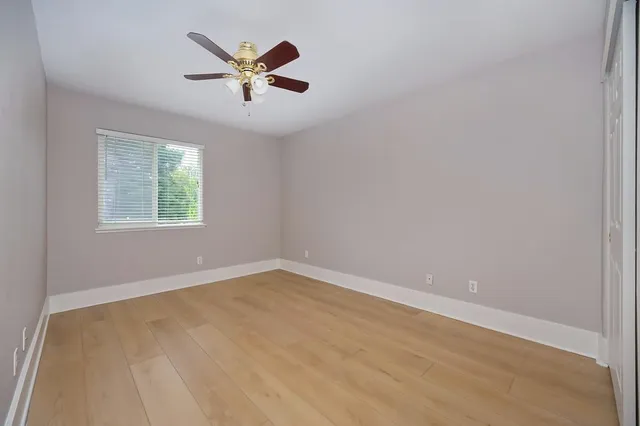 a bathroom with a sink a toilet a shower and a mirror