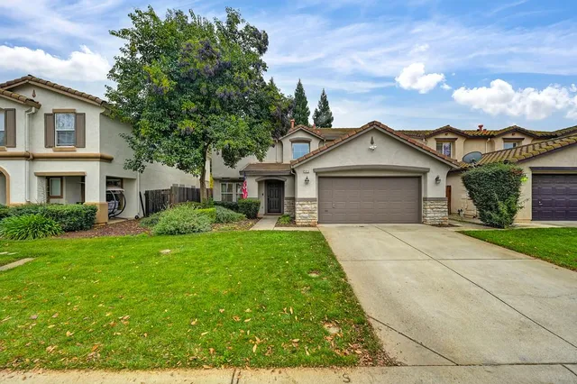 front view of a house with a yard
