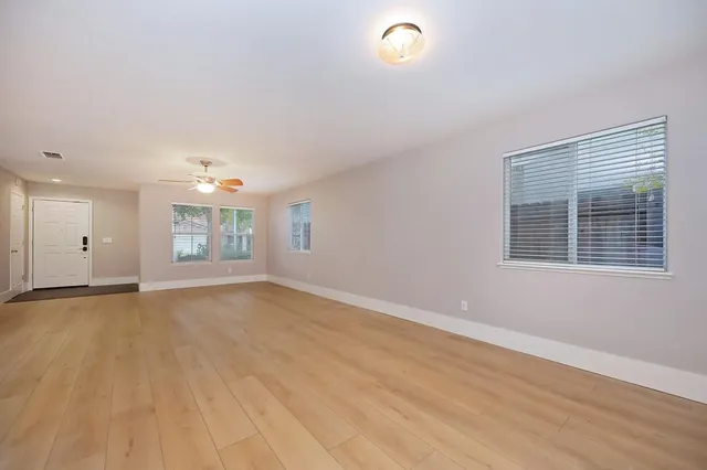 a view of an empty room with a window