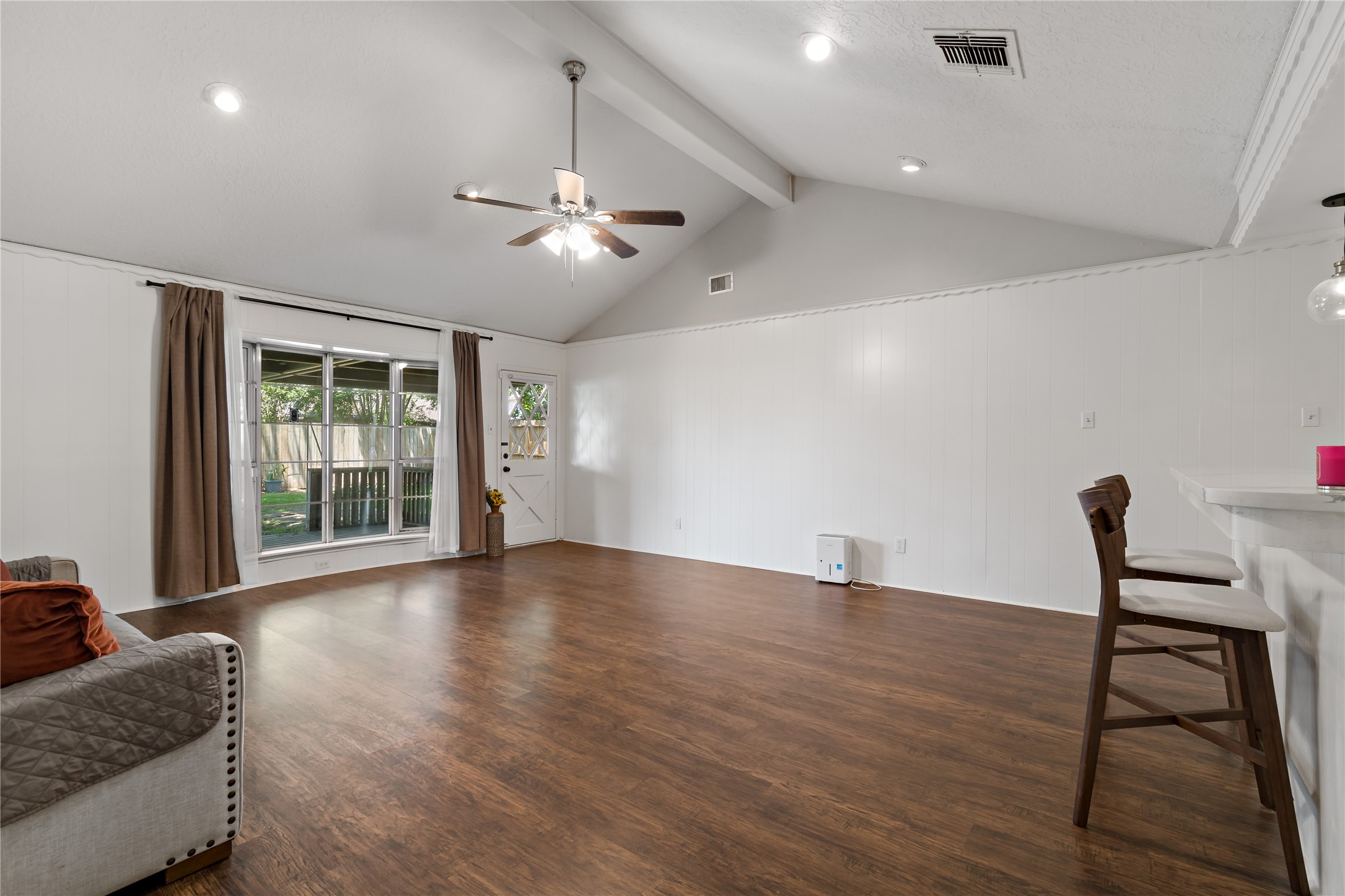 4302 Seneca Street Pasadena, TX 77504 - Photo 6 of 19 a view of an empty room with a window and wooden floor