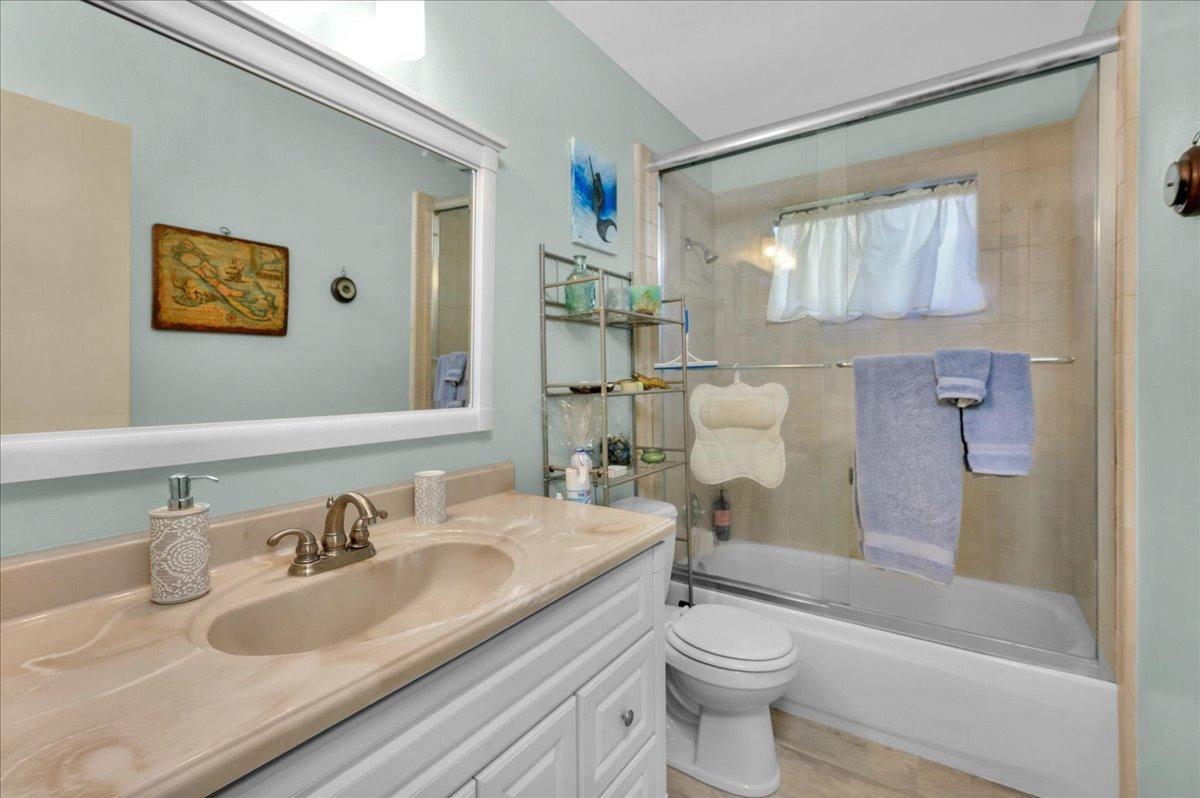 26982 Twin Ponds Road Clovis, CA 93619 - Photo 20 of 48 a bathroom with a sink toilet and shower