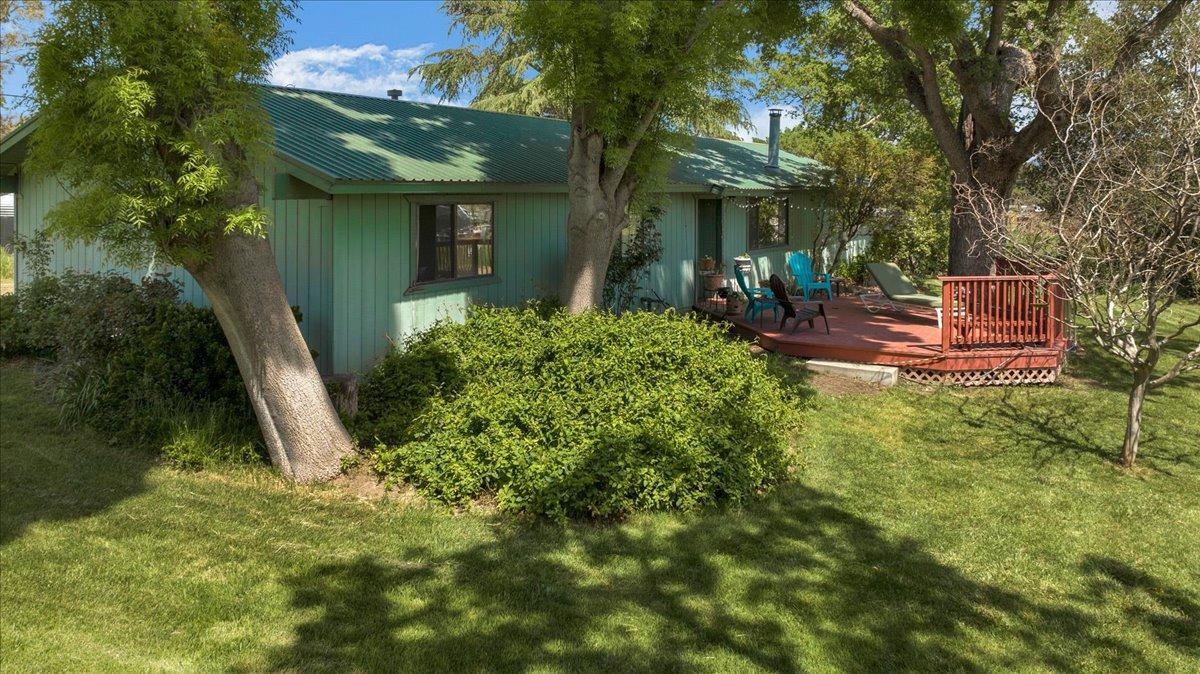 26982 Twin Ponds Road Clovis, CA 93619 - Photo 2 of 48 a view of a house with a yard and plants