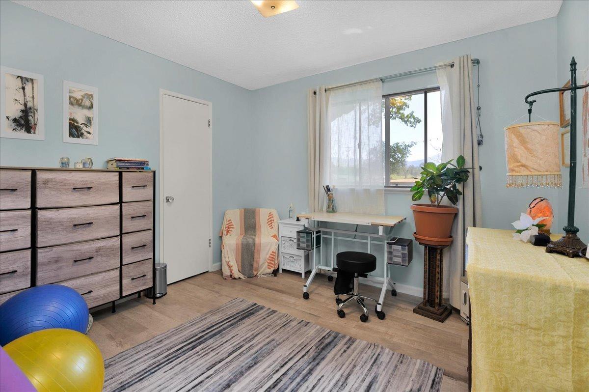 26982 Twin Ponds Road Clovis, CA 93619 - Photo 21 of 48 a work room with furniture and a fireplace