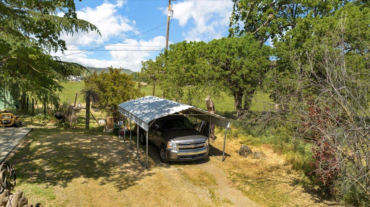 26982 Twin Ponds Road Clovis, CA 93619 - Photo 39 of 48 a front view of a house with a yard