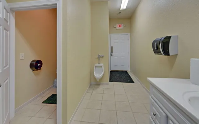 an aerial view of residential houses with outdoor space and swimming pool