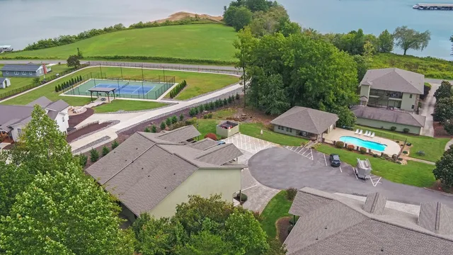 an aerial view of a house with garden space and street view
